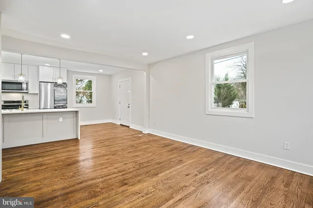 a view of kitchen with wooden floor and window