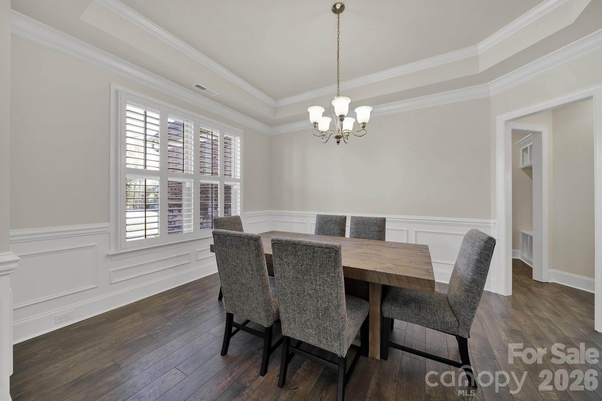 6507 Calvert Commons Drive Huntersville, NC 28078 - Photo 14 of 47 a view of a dining room with furniture window and wooden floor