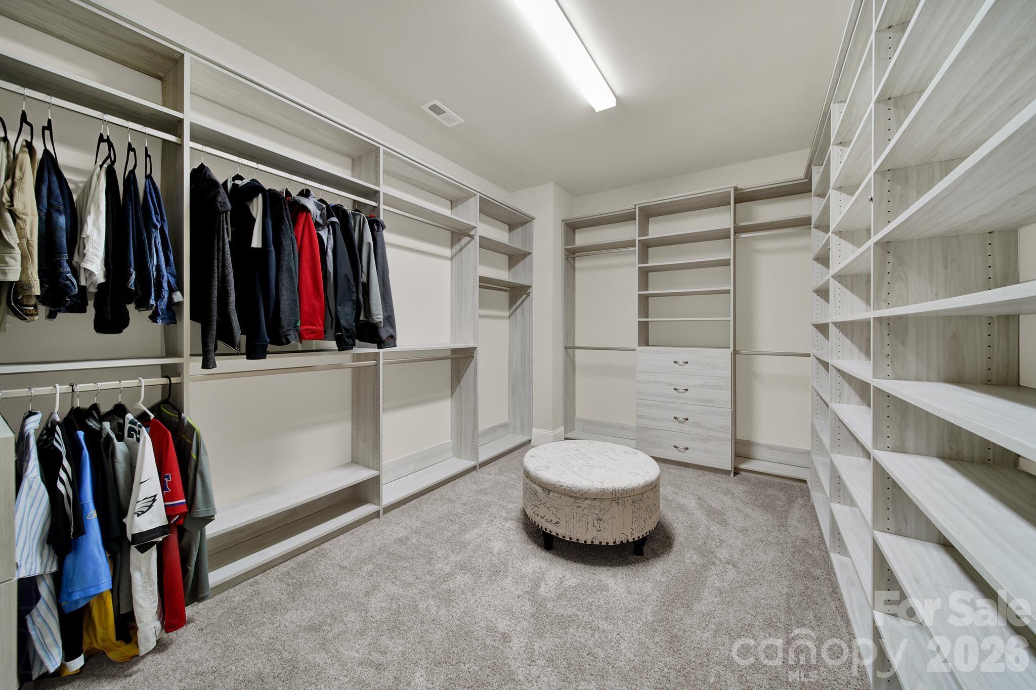 6507 Calvert Commons Drive Huntersville, NC 28078 - Photo 21 of 47 a view of walk in closet with clothes and shoes