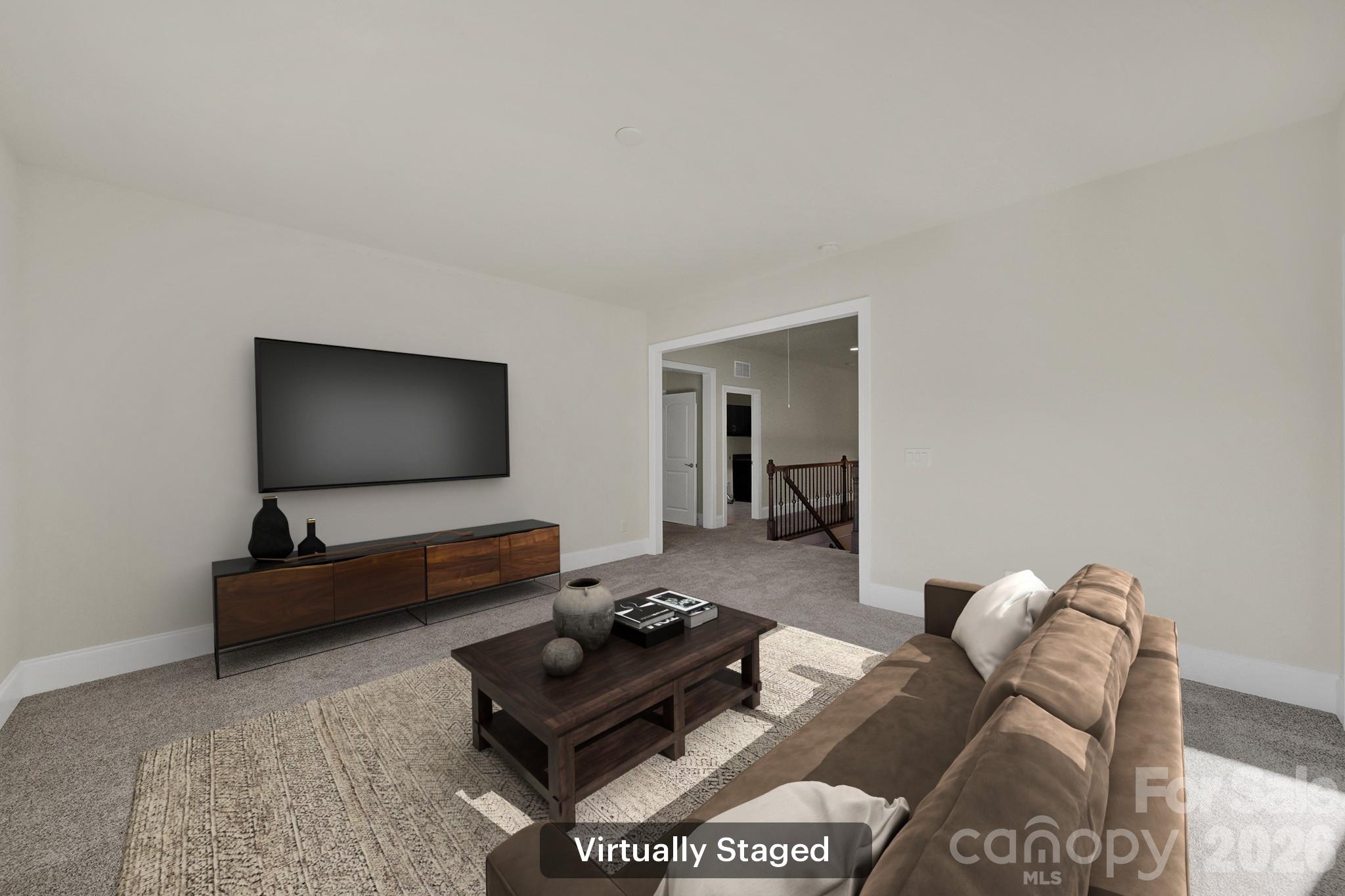 6507 Calvert Commons Drive Huntersville, NC 28078 - Photo 30 of 47 a living room with furniture and a flat screen tv