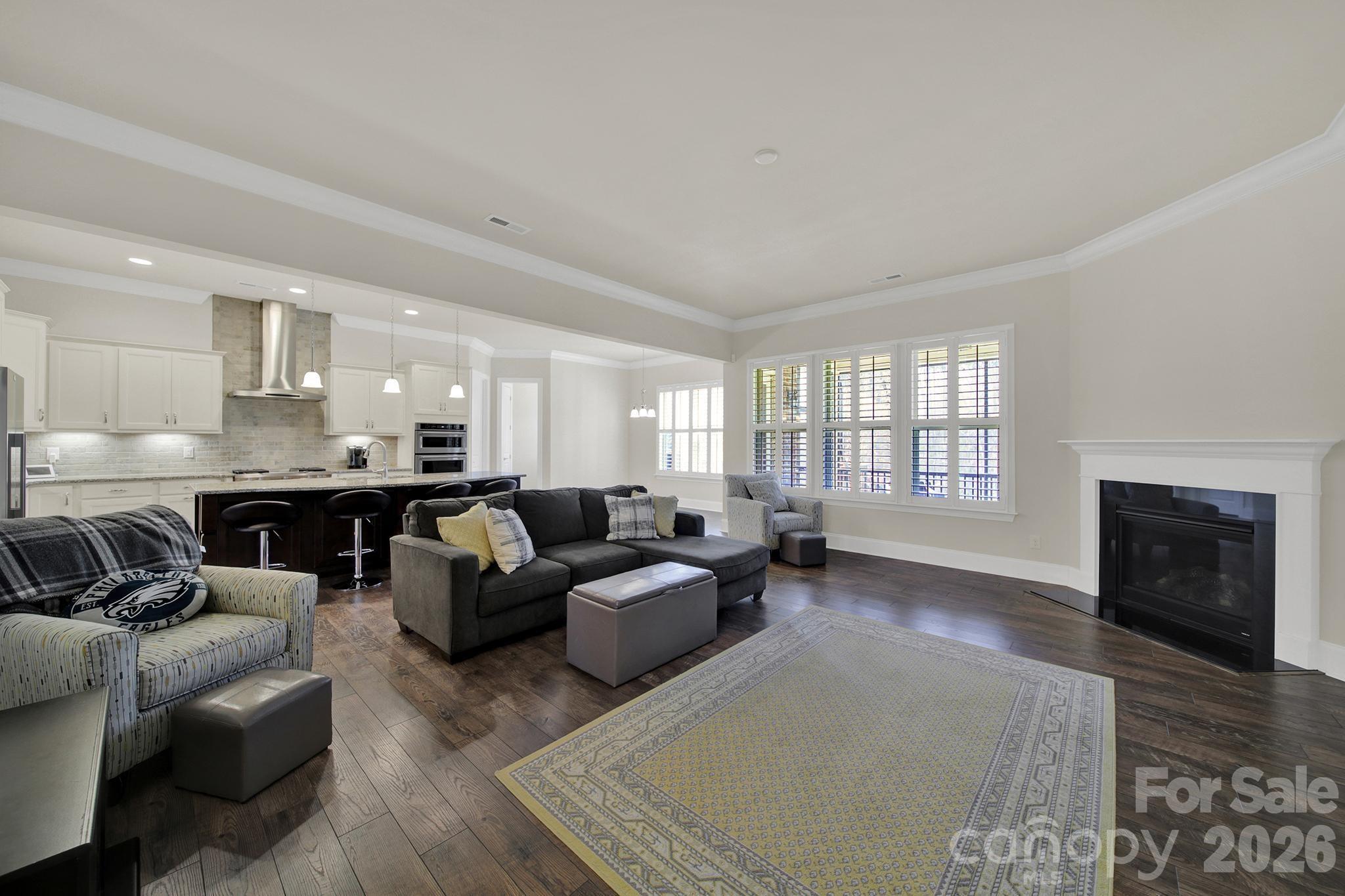6507 Calvert Commons Drive Huntersville, NC 28078 - Photo 3 of 47 a living room with furniture and a fireplace