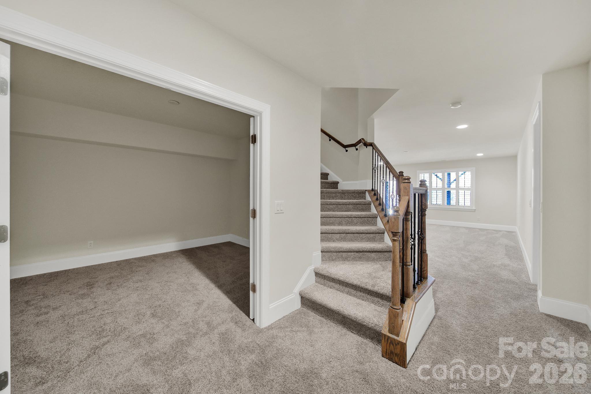 6507 Calvert Commons Drive Huntersville, NC 28078 - Photo 34 of 47 a view of a hallway with staircase