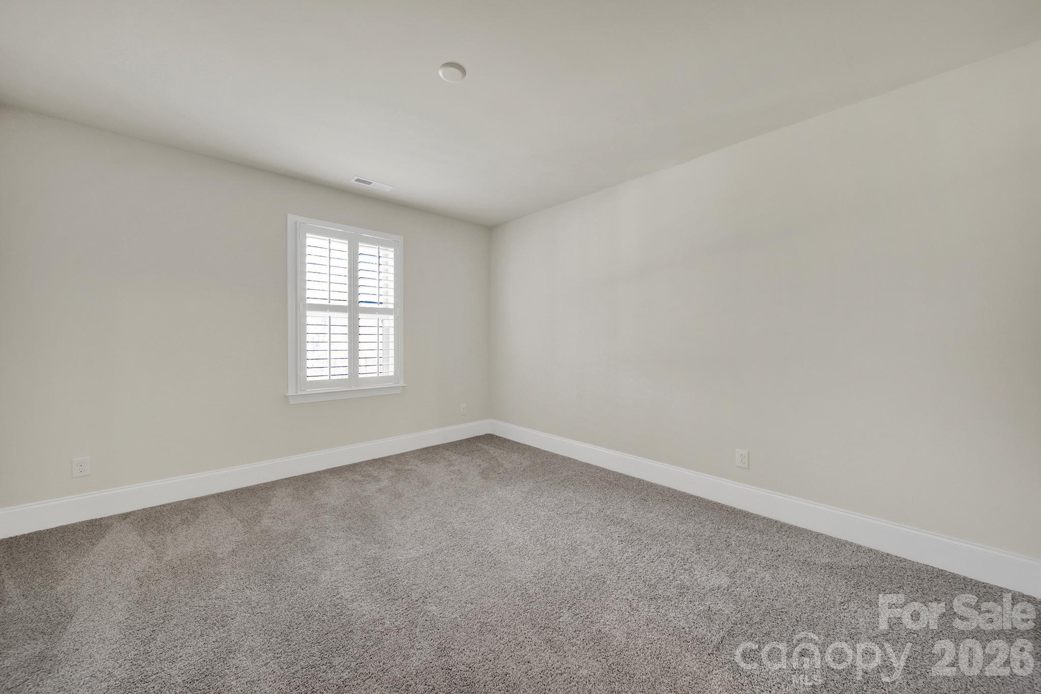 6507 Calvert Commons Drive Huntersville, NC 28078 - Photo 37 of 47 an empty room with a window