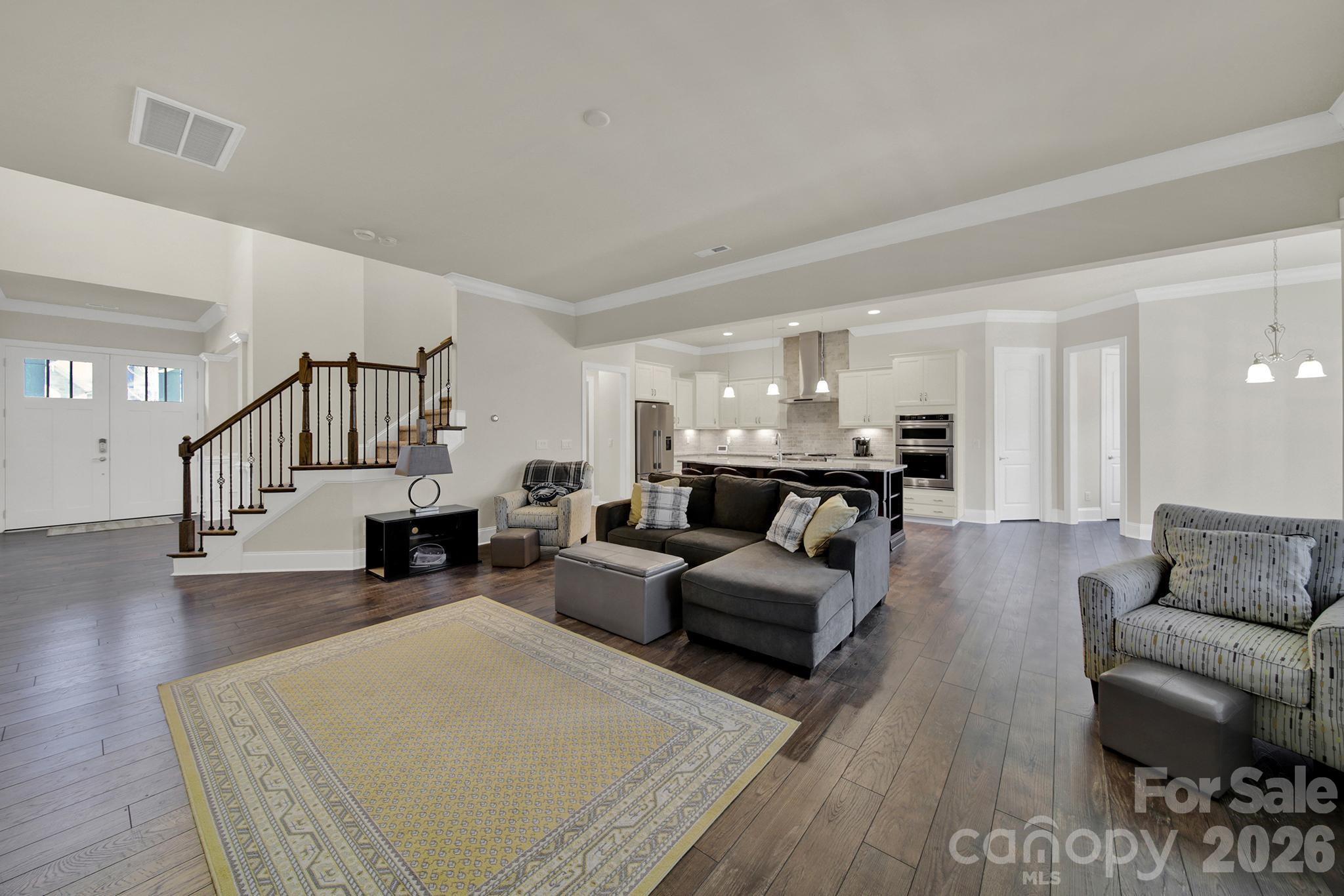 6507 Calvert Commons Drive Huntersville, NC 28078 - Photo 4 of 47 a living room with furniture and wooden floor