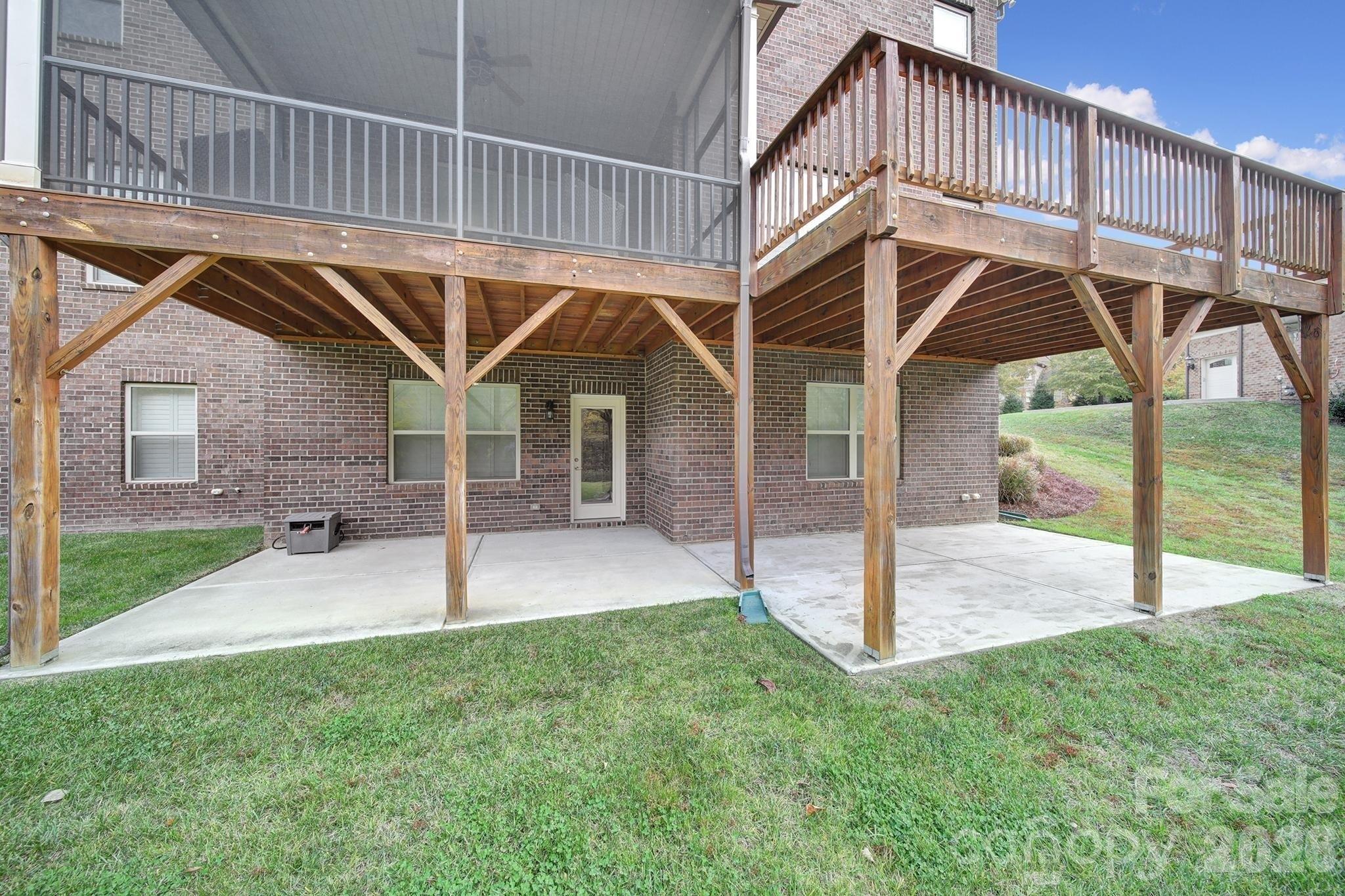 6507 Calvert Commons Drive Huntersville, NC 28078 - Photo 41 of 47 a view of a house with a yard and deck