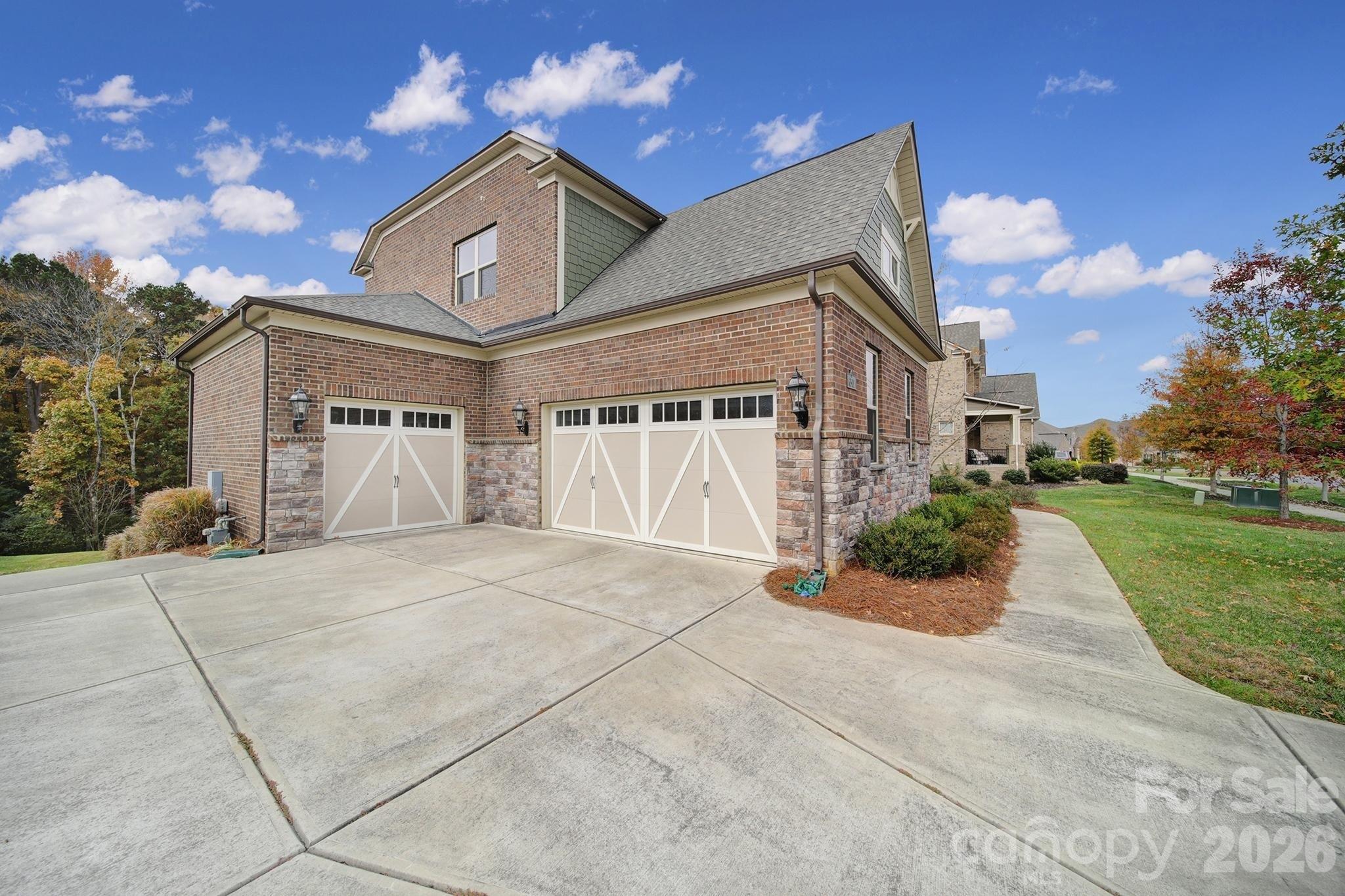 6507 Calvert Commons Drive Huntersville, NC 28078 - Photo 44 of 47 a front view of a house with a yard and garage