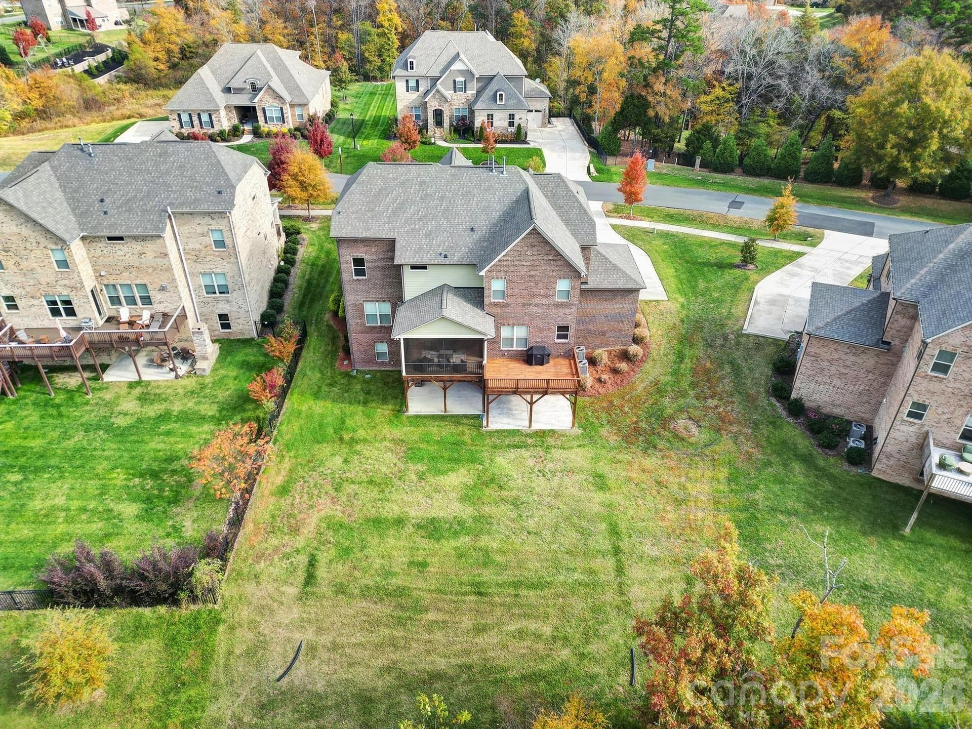 6507 Calvert Commons Drive Huntersville, NC 28078 - Photo 46 of 47 an aerial view of a house with swimming pool garden and mountain view in back