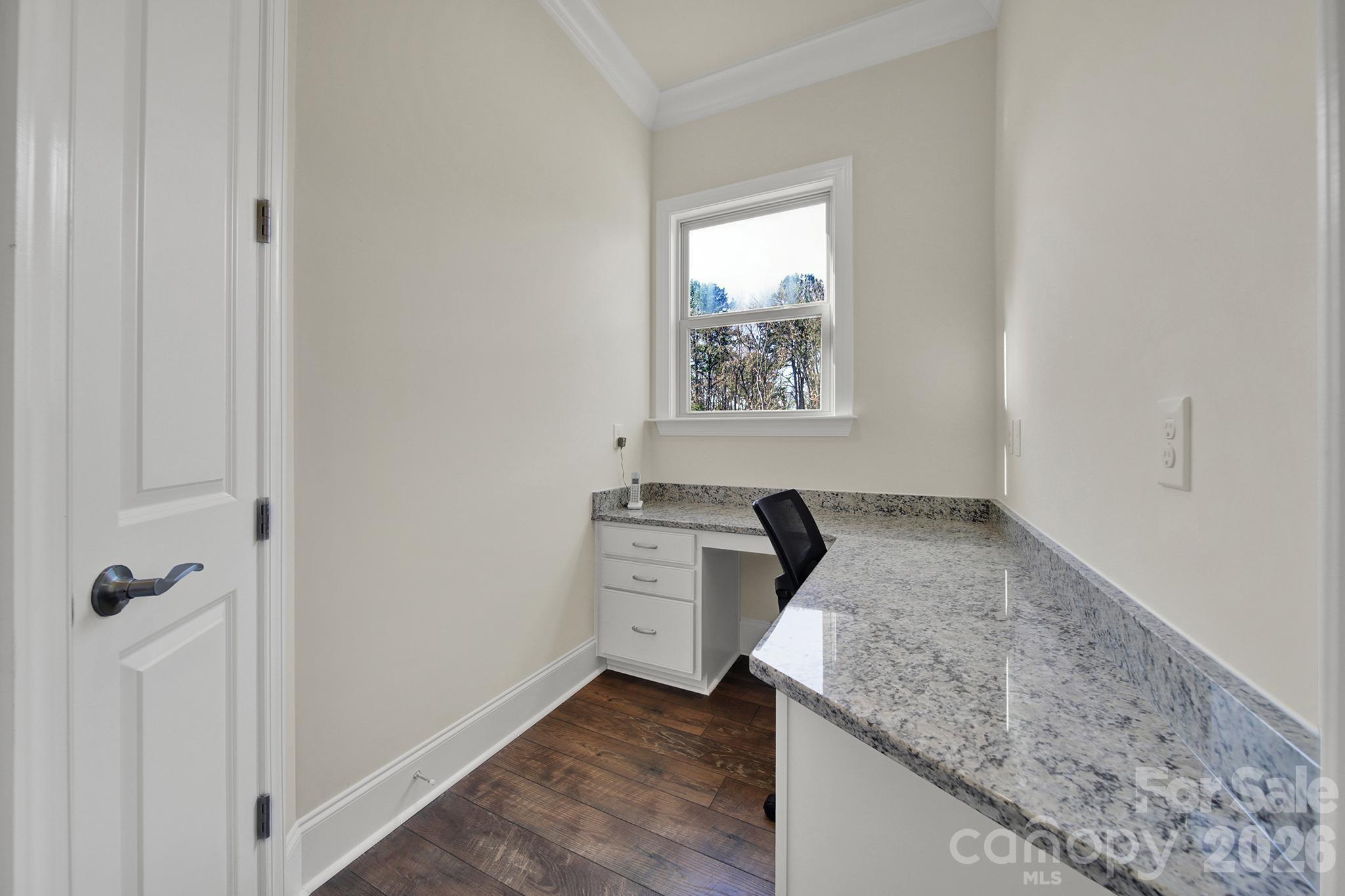 6507 Calvert Commons Drive Huntersville, NC 28078 - Photo 9 of 47 a kitchen with a granite countertop sink and stove