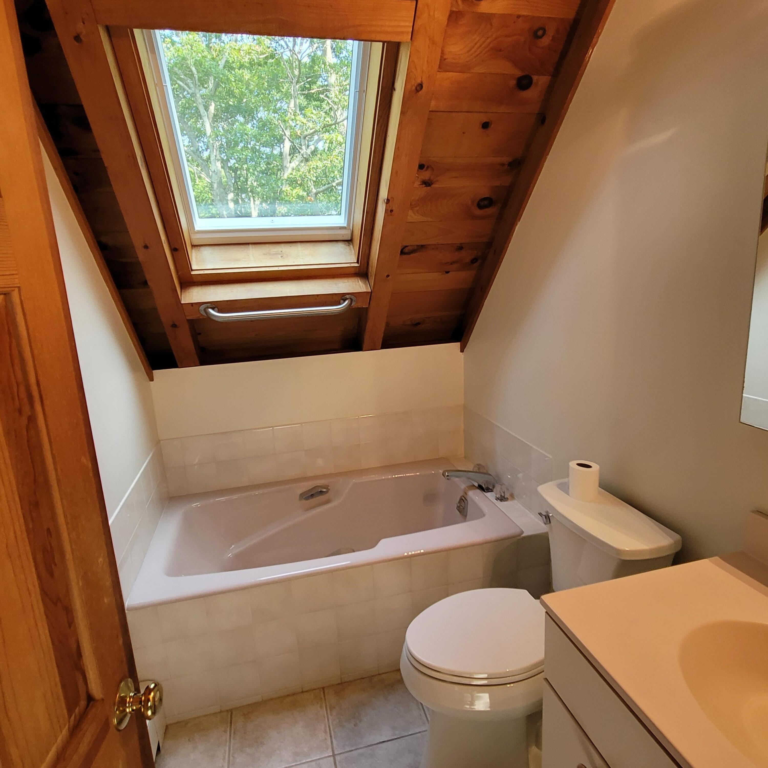 73 Suomi Road Hyannis, MA 02601 - Photo 11 of 13 a bathroom with a bathtub and a toilet