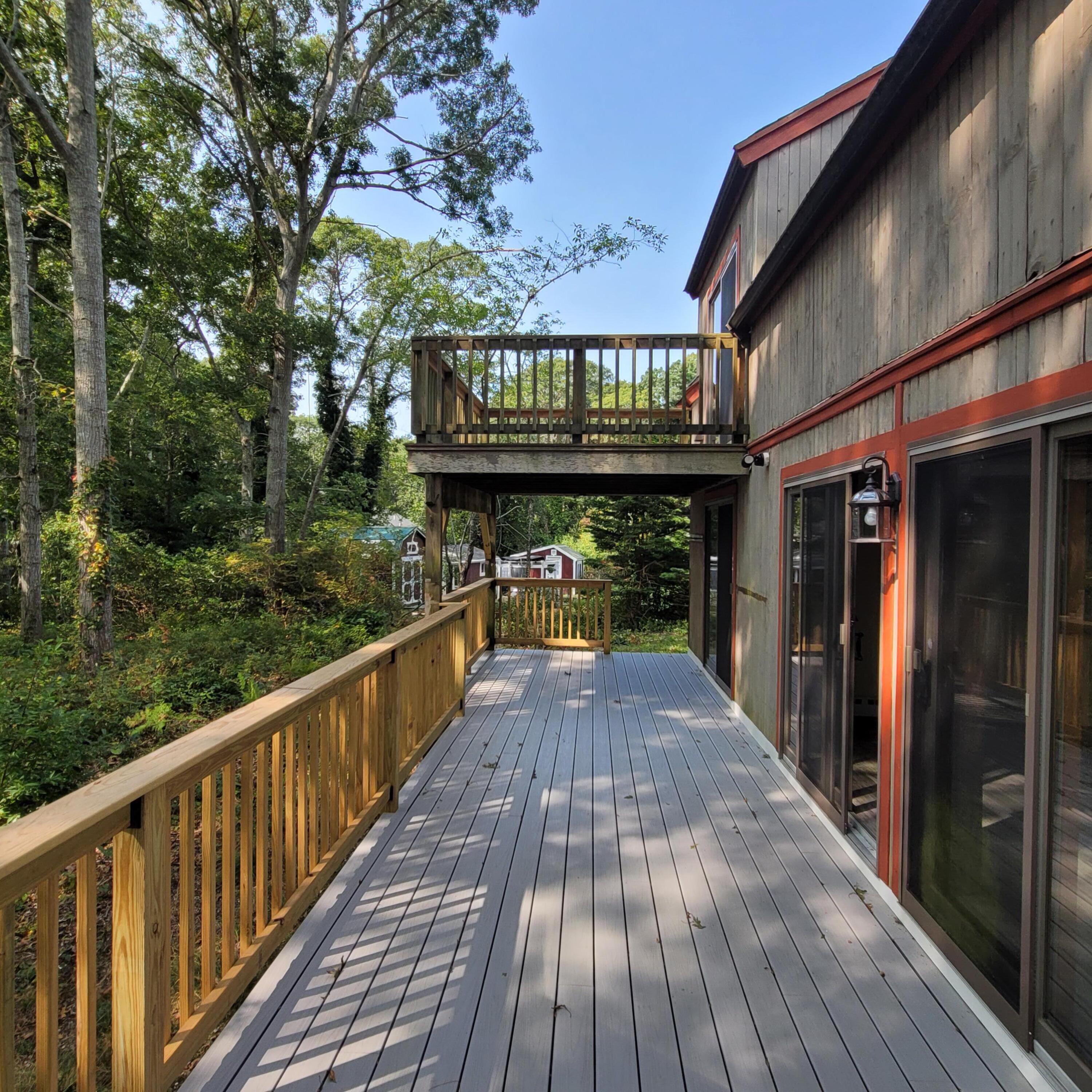 73 Suomi Road Hyannis, MA 02601 - Photo 12 of 13 a view of balcony with wooden floor and fence
