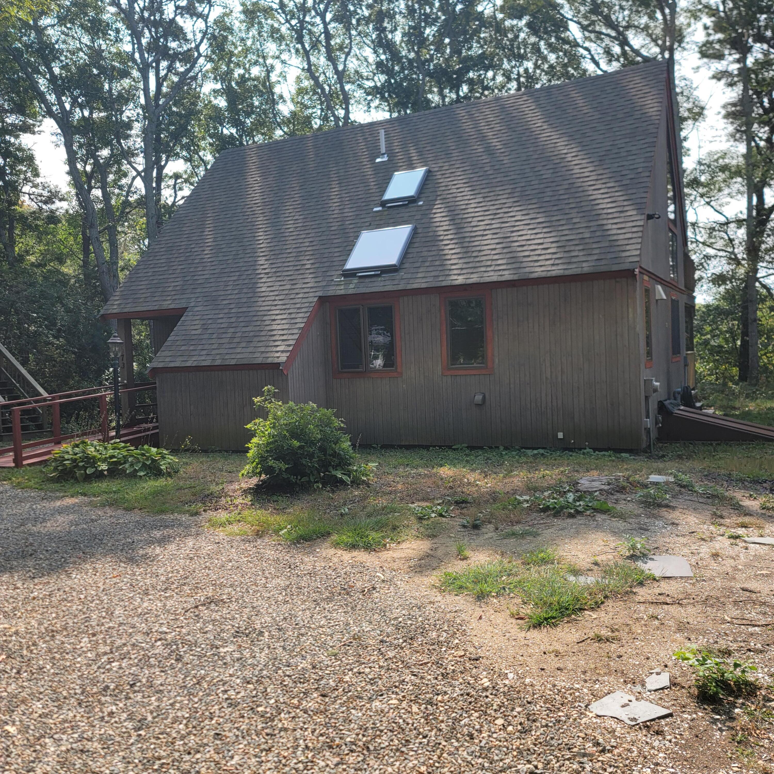 73 Suomi Road Hyannis, MA 02601 - Photo 2 of 13 a front view of a house with garden