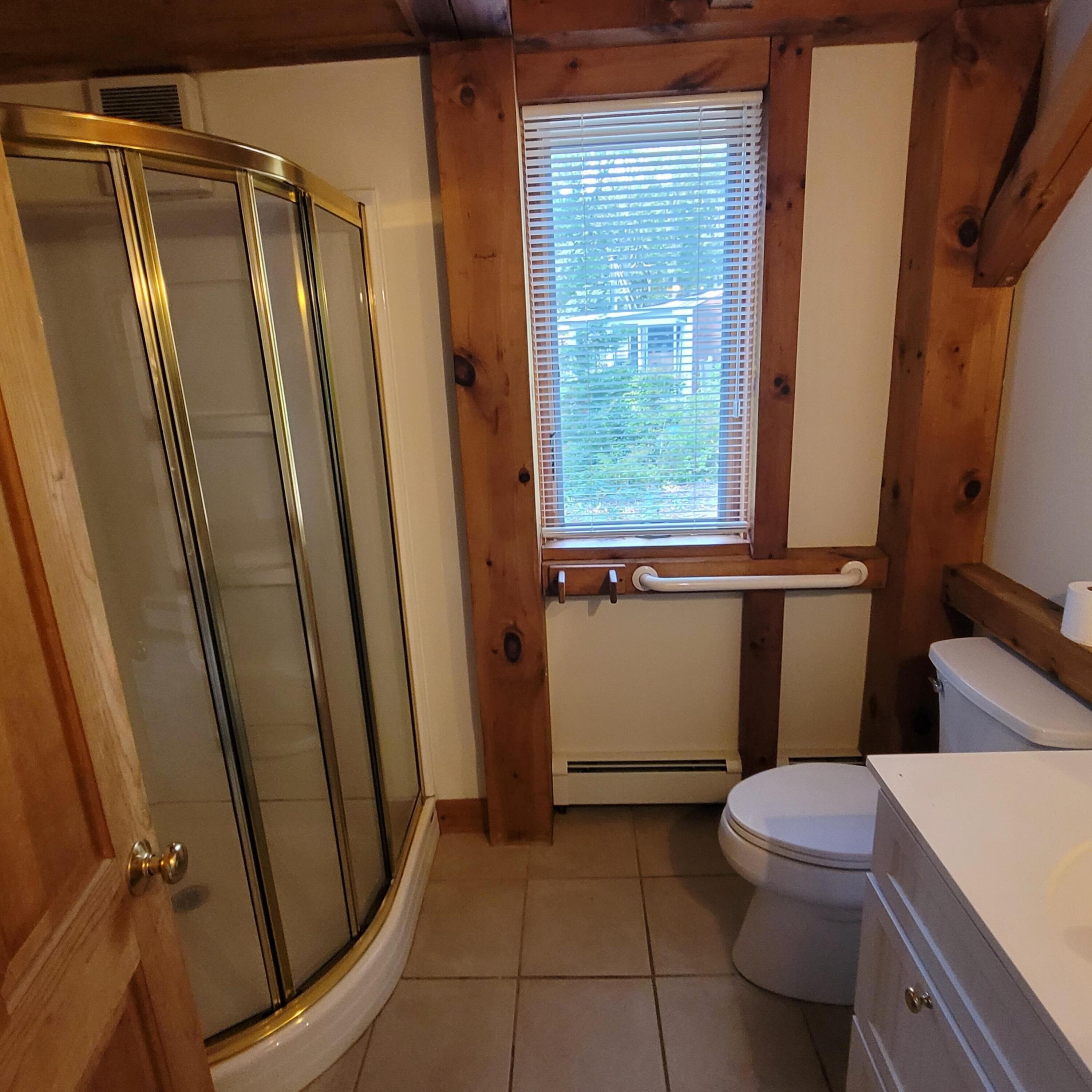 73 Suomi Road Hyannis, MA 02601 - Photo 8 of 13 a bathroom with a sink a toilet a mirror and shower