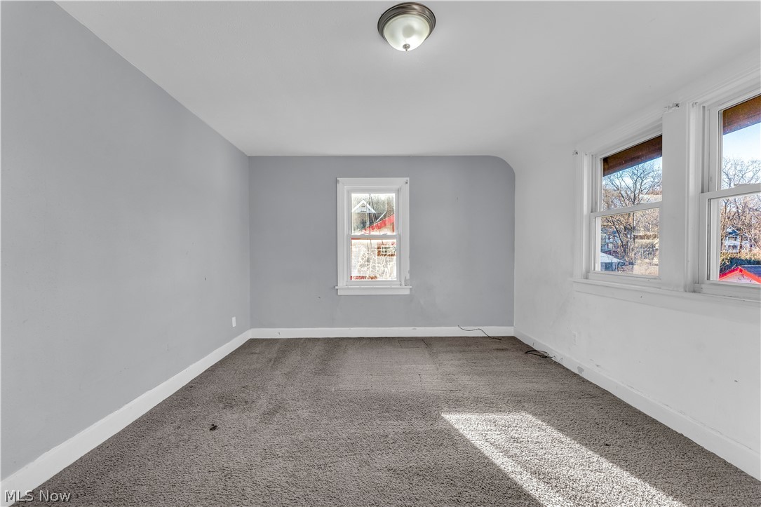 1858 Rudwick Road Cleveland, OH 44112 - Photo 18 of 36 Carpeted empty room featuring baseboards
