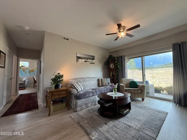 a room with wine cabinets and a window