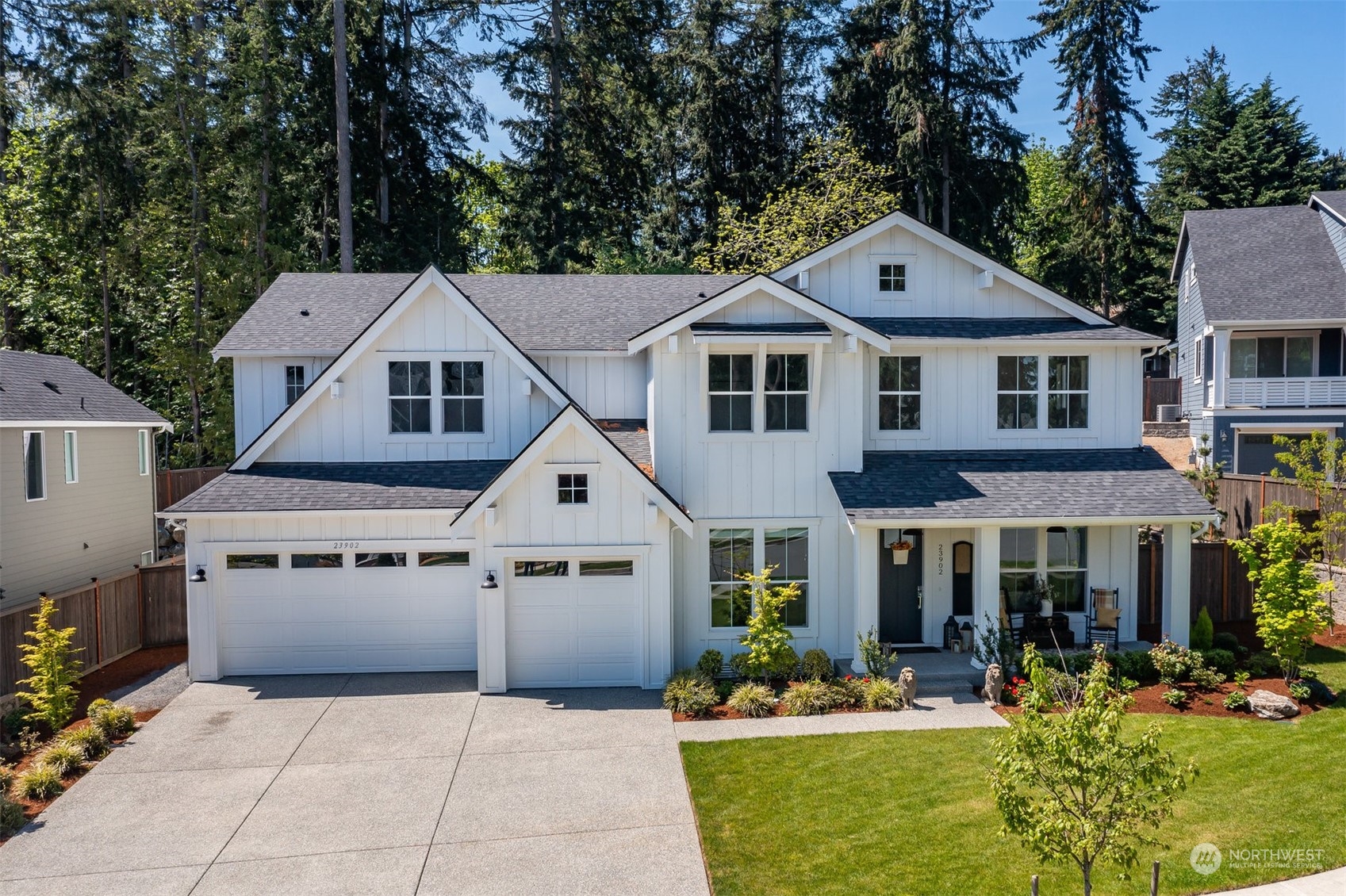 23902 1st Avenue Southeast Bothell, WA 98021 - Photo 1 of 39 a front view of a house with a yard and garage