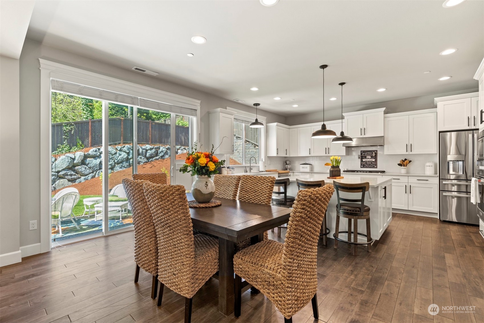 23902 1st Avenue Southeast Bothell, WA 98021 - Photo 13 of 39 a dining room with furniture and a large window