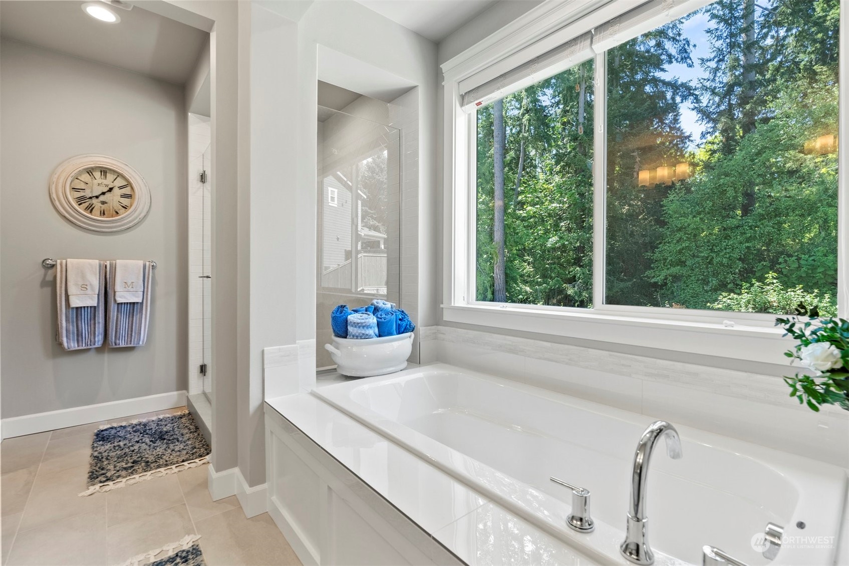 23902 1st Avenue Southeast Bothell, WA 98021 - Photo 23 of 39 a bath tub sitting in a bathroom next to a window