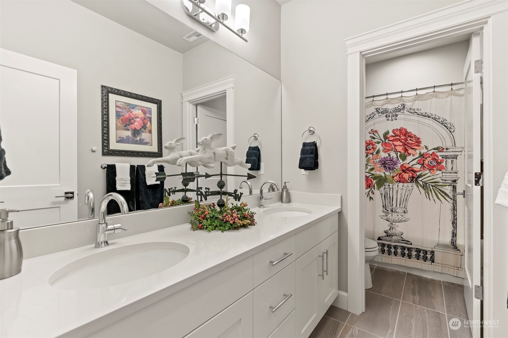 23902 1st Avenue Southeast Bothell, WA 98021 - Photo 27 of 39 a bathroom with double vanity sinks a mirror and a shower