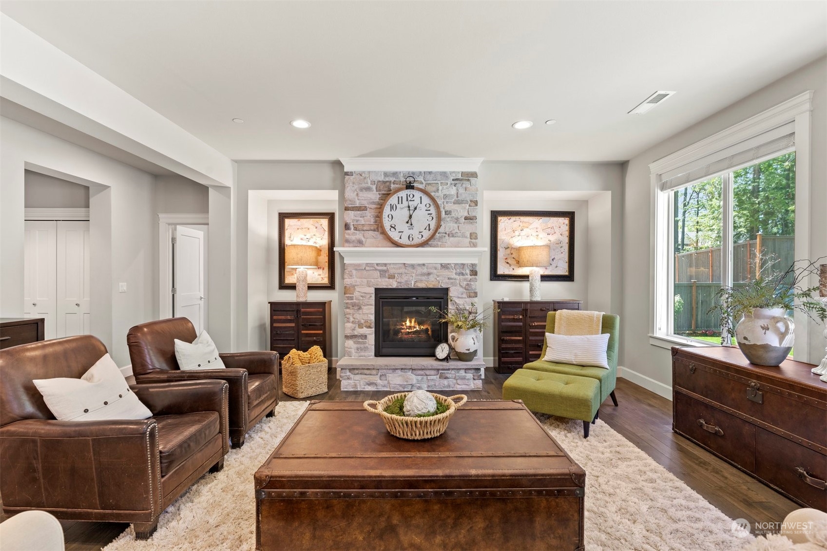 23902 1st Avenue Southeast Bothell, WA 98021 - Photo 4 of 39 a living room with furniture and a fireplace