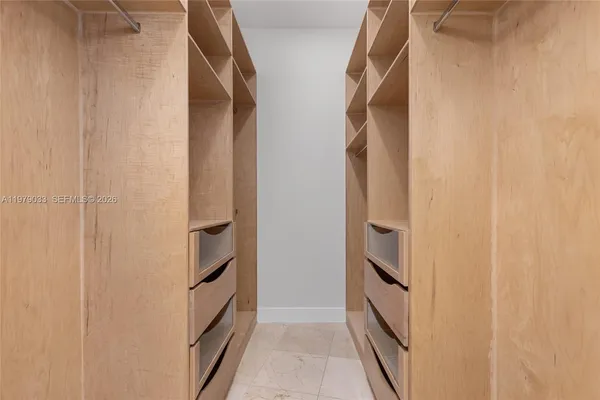 a bathroom with a shower sink vanity mirror and toilet
