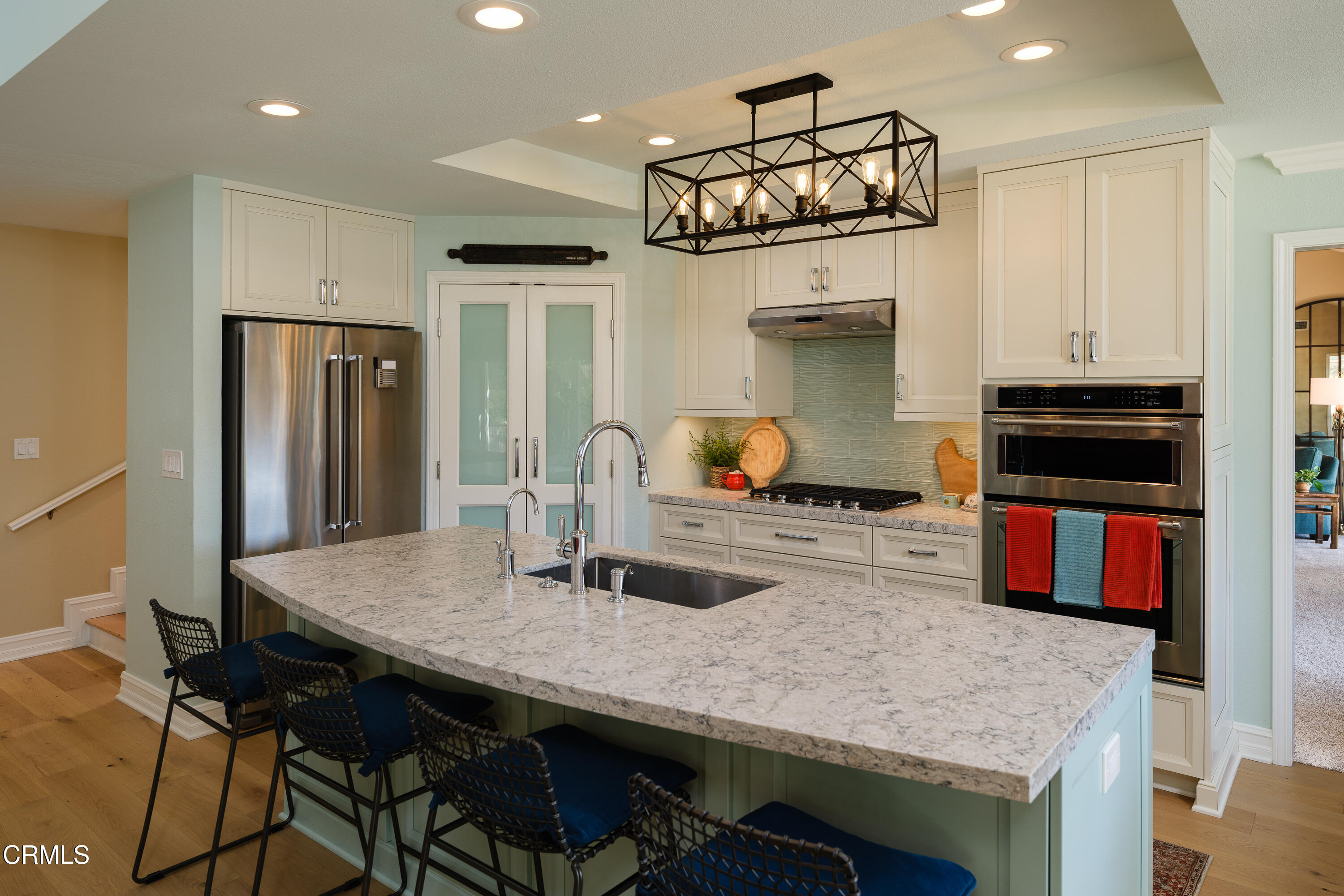 7271 Brydon Road La Verne, CA 91750 - Photo 15 of 63 a kitchen with stainless steel appliances a table and chairs in it