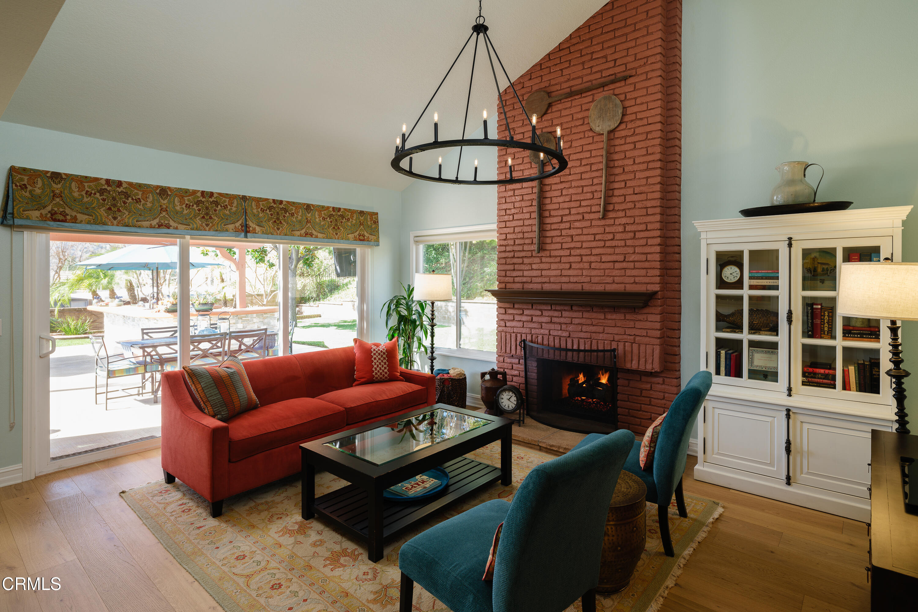 7271 Brydon Road La Verne, CA 91750 - Photo 17 of 63 a living room with furniture a chandelier and a fireplace