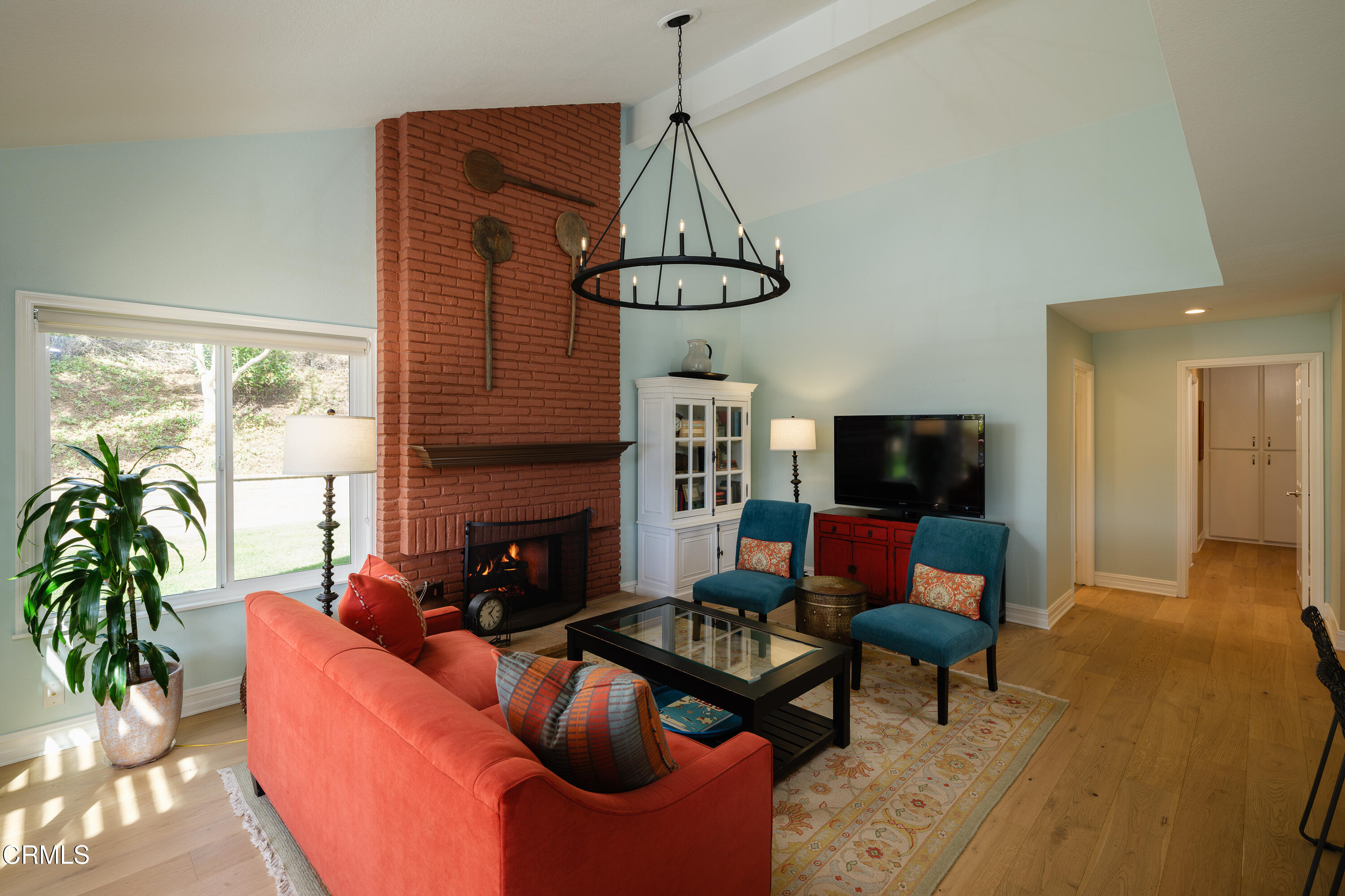 7271 Brydon Road La Verne, CA 91750 - Photo 19 of 63 a living room with furniture a flat screen tv and a window