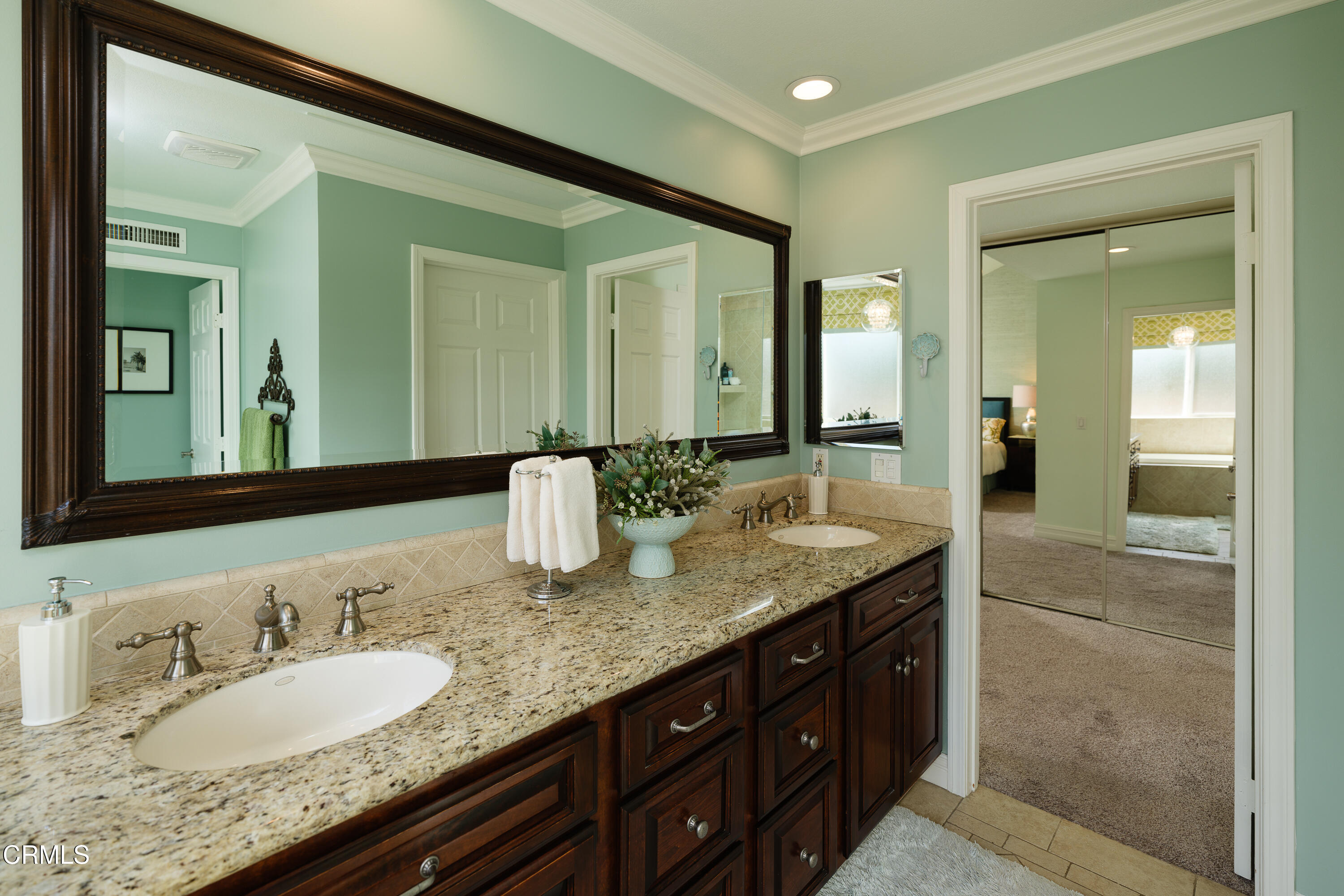 7271 Brydon Road La Verne, CA 91750 - Photo 32 of 63 a bathroom with a granite countertop double vanity sink and a mirror