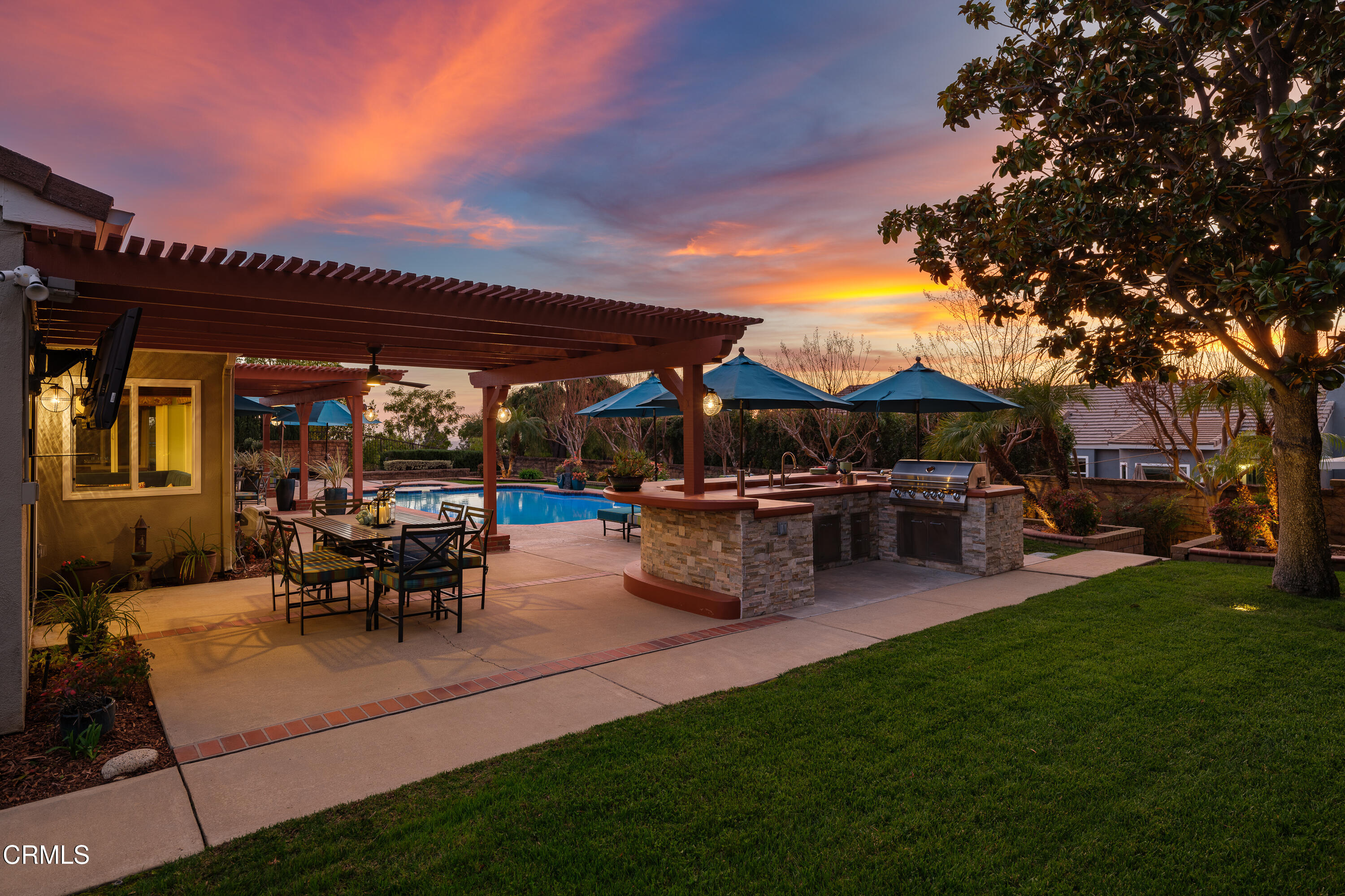 7271 Brydon Road La Verne, CA 91750 - Photo 35 of 63 a view of a patio with table and chairs potted plants and a large tree