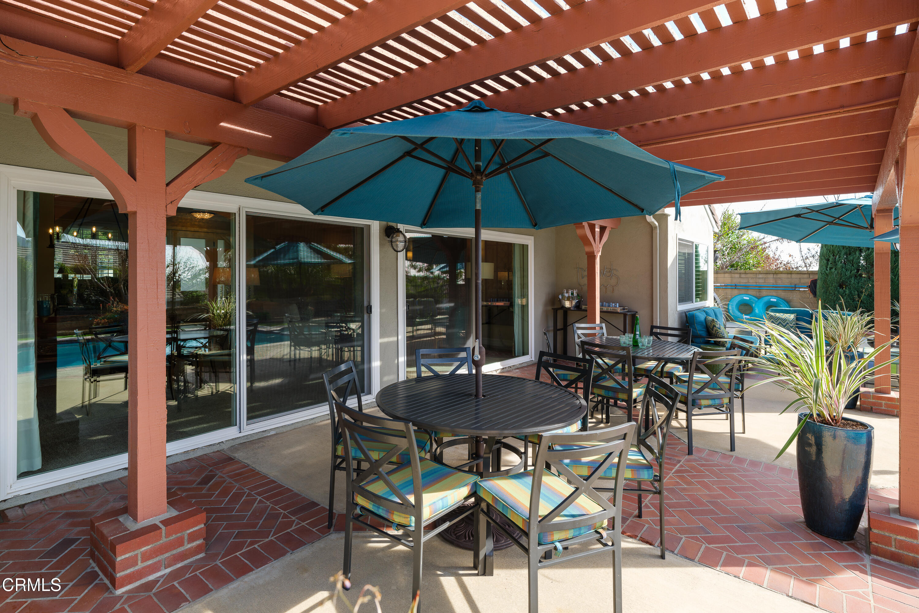 7271 Brydon Road La Verne, CA 91750 - Photo 52 of 63 a view of a patio with table and chairs under an umbrella