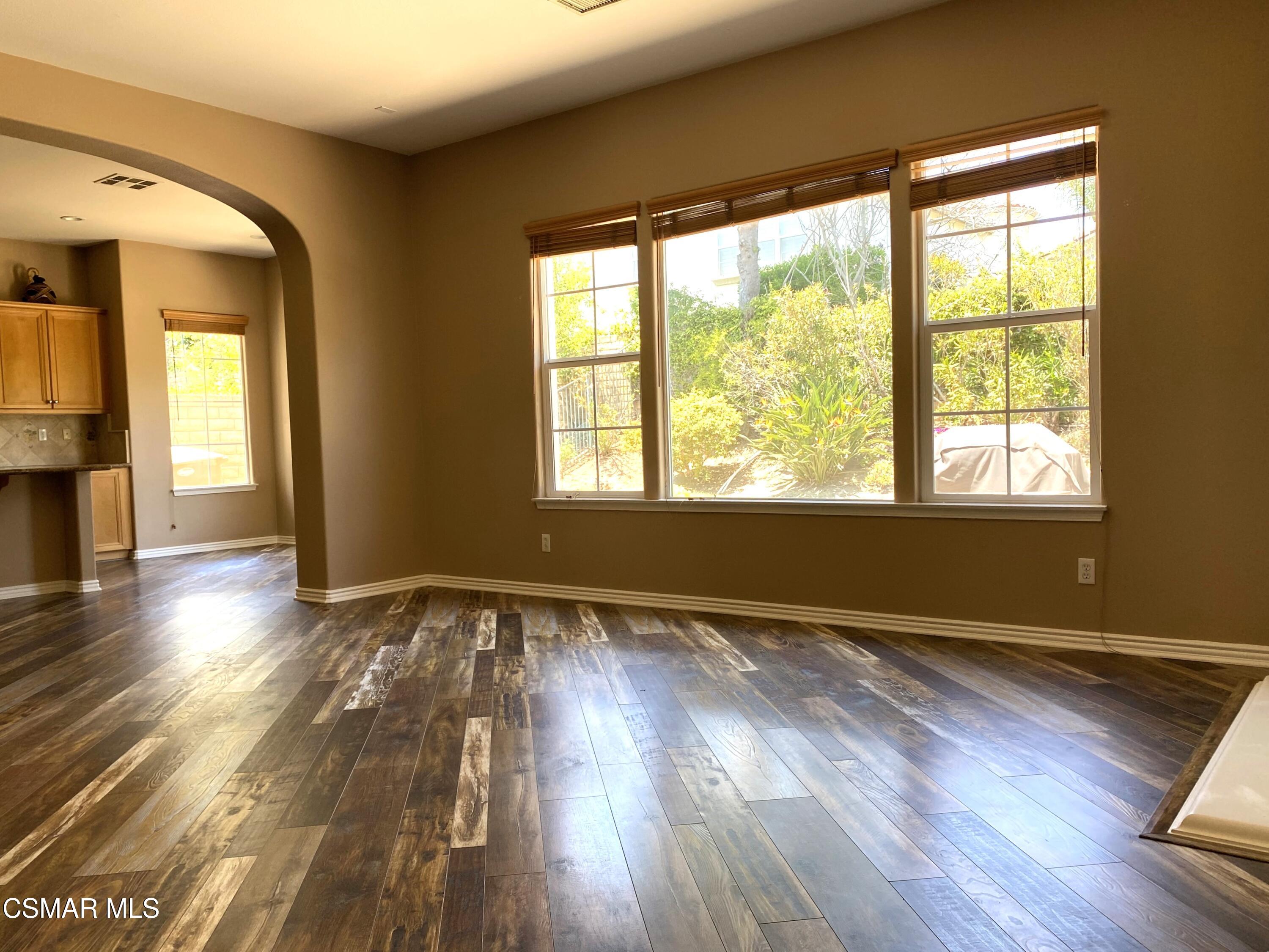 4501 Via Rio Newbury Park, CA 91320 - Photo 13 of 24 a view of an empty room with wooden floor and a window
