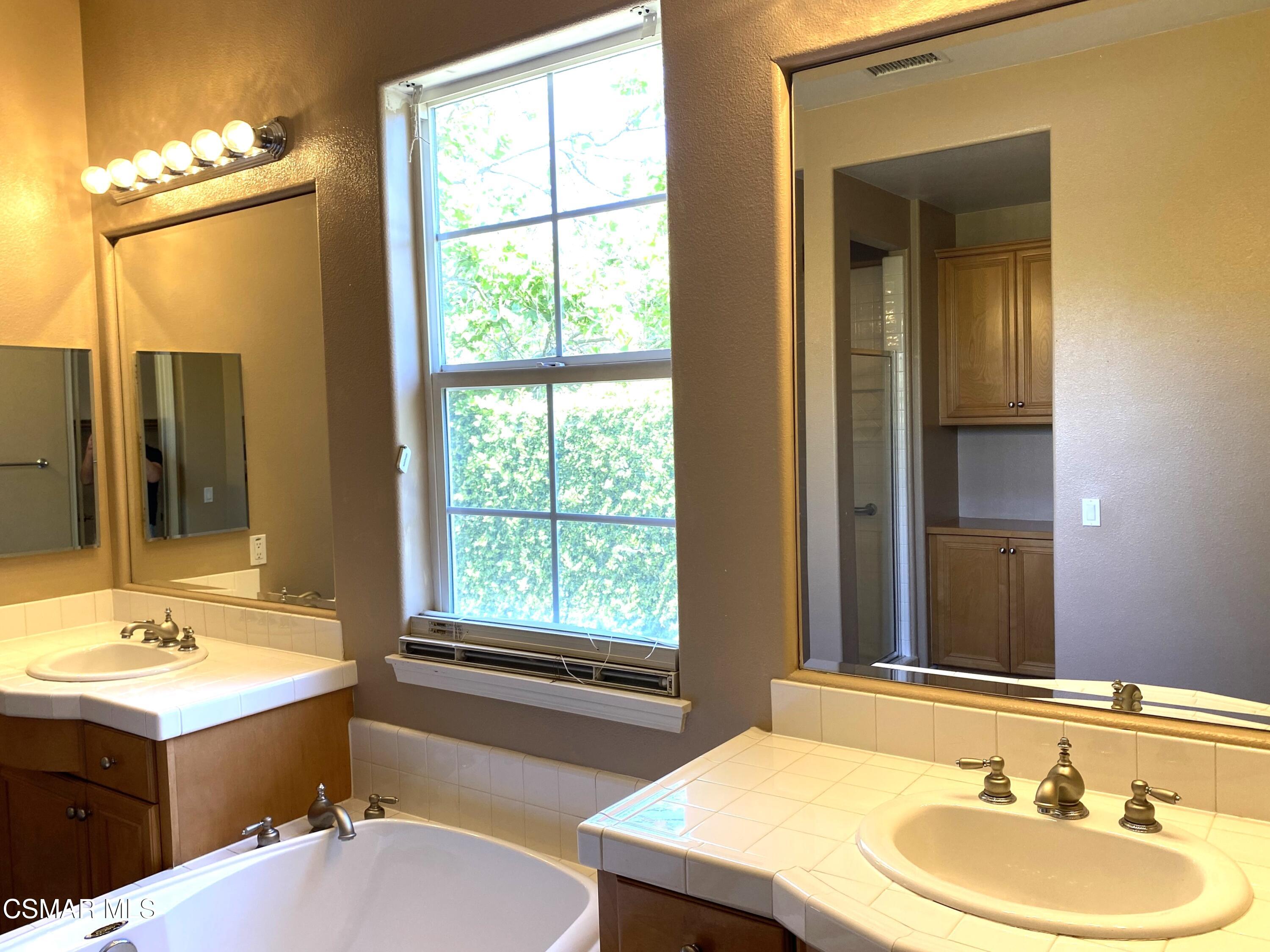 4501 Via Rio Newbury Park, CA 91320 - Photo 19 of 24 a bathroom with a sink and a mirror