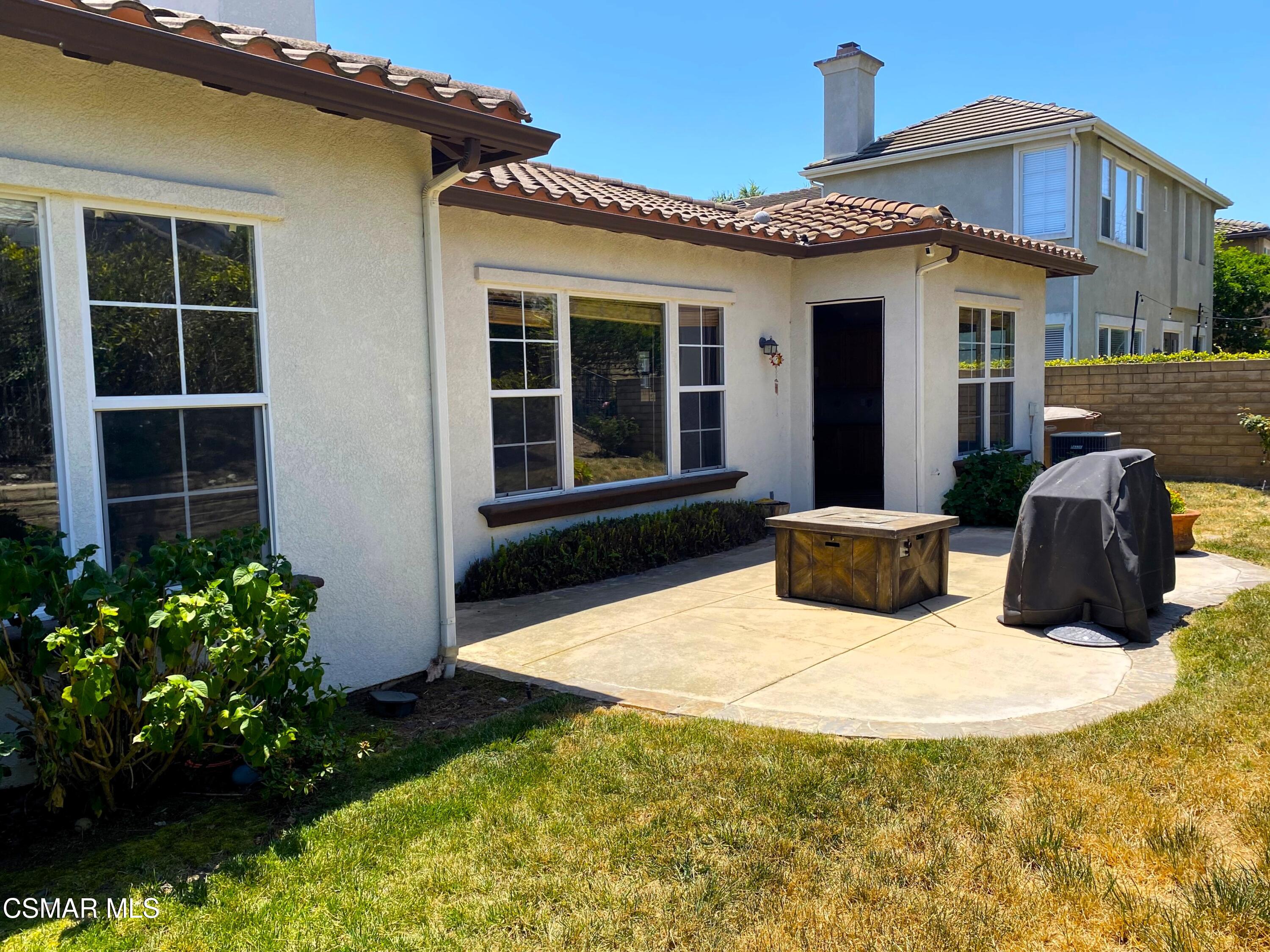 4501 Via Rio Newbury Park, CA 91320 - Photo 20 of 24 a view of a house with backyard sitting area and garden