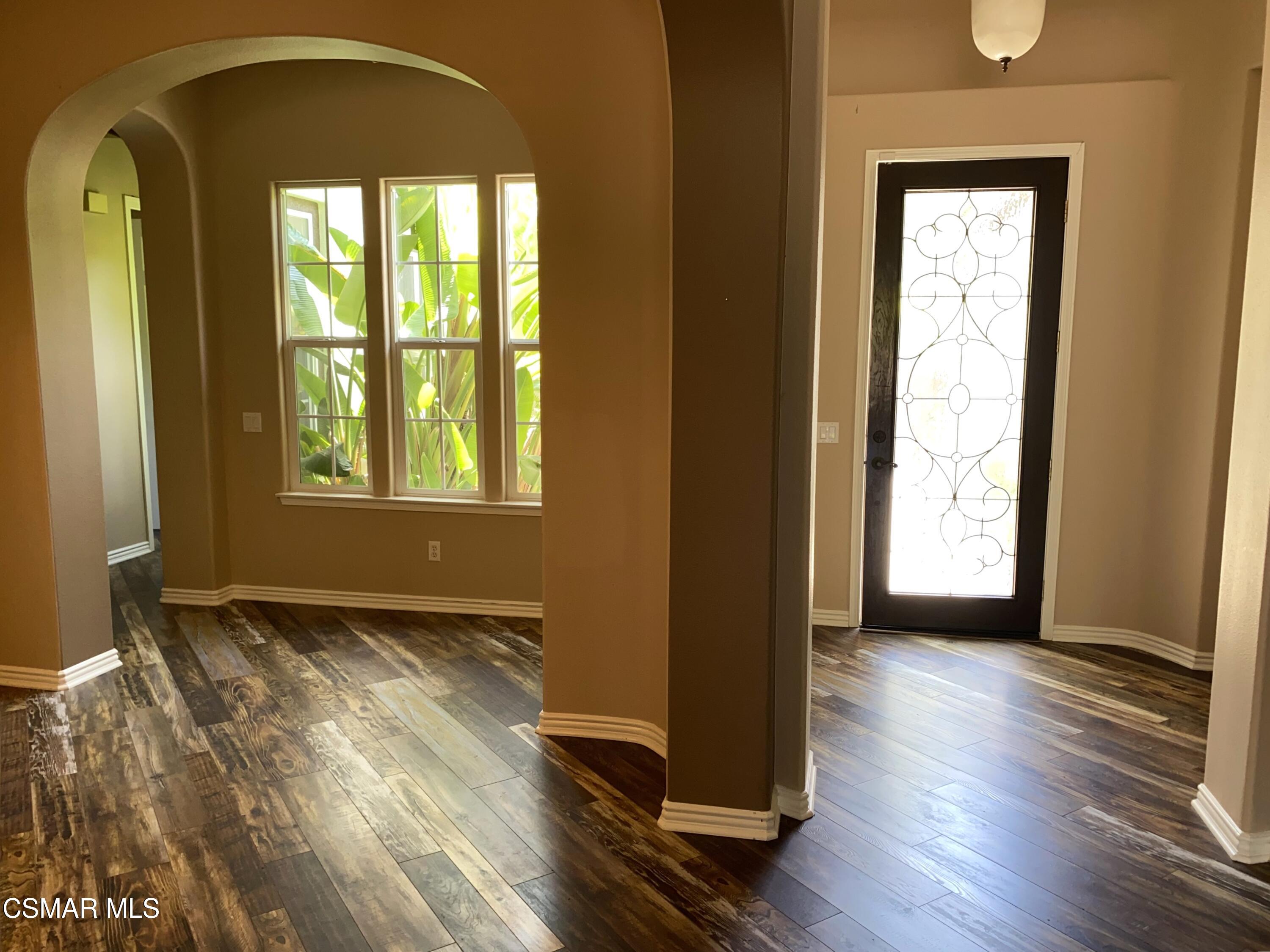 4501 Via Rio Newbury Park, CA 91320 - Photo 5 of 24 a view of an empty room with wooden floor and a window