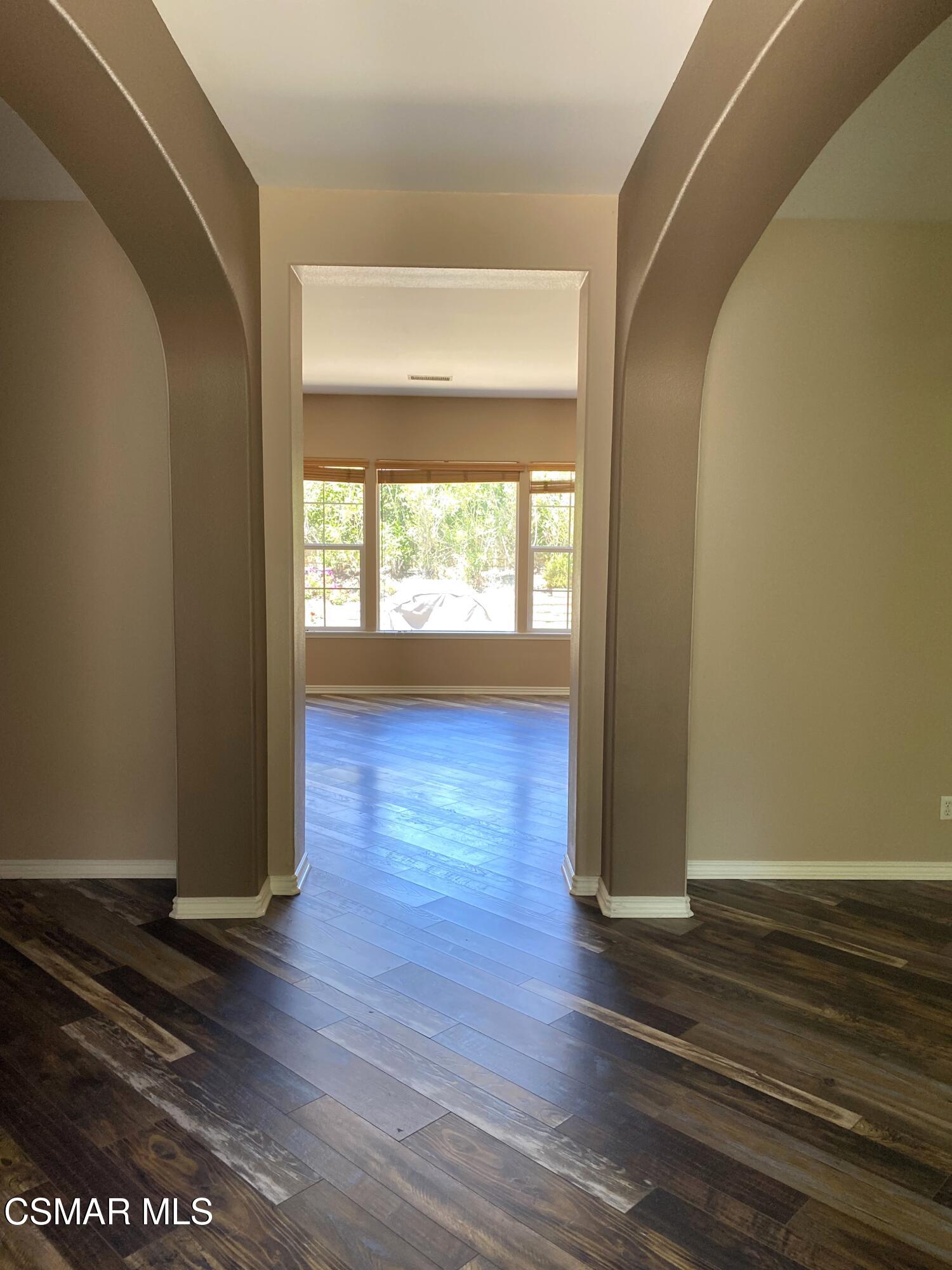 4501 Via Rio Newbury Park, CA 91320 - Photo 6 of 24 an empty room with wooden floor and windows