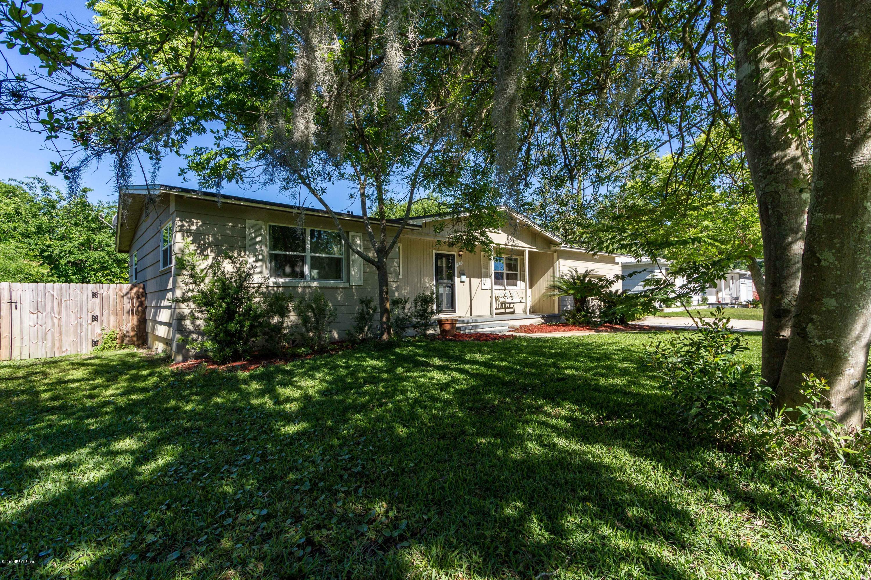 7420 Hennessy Road Jacksonville, FL 32244 - Photo 2 of 39 a view of a house with a yard