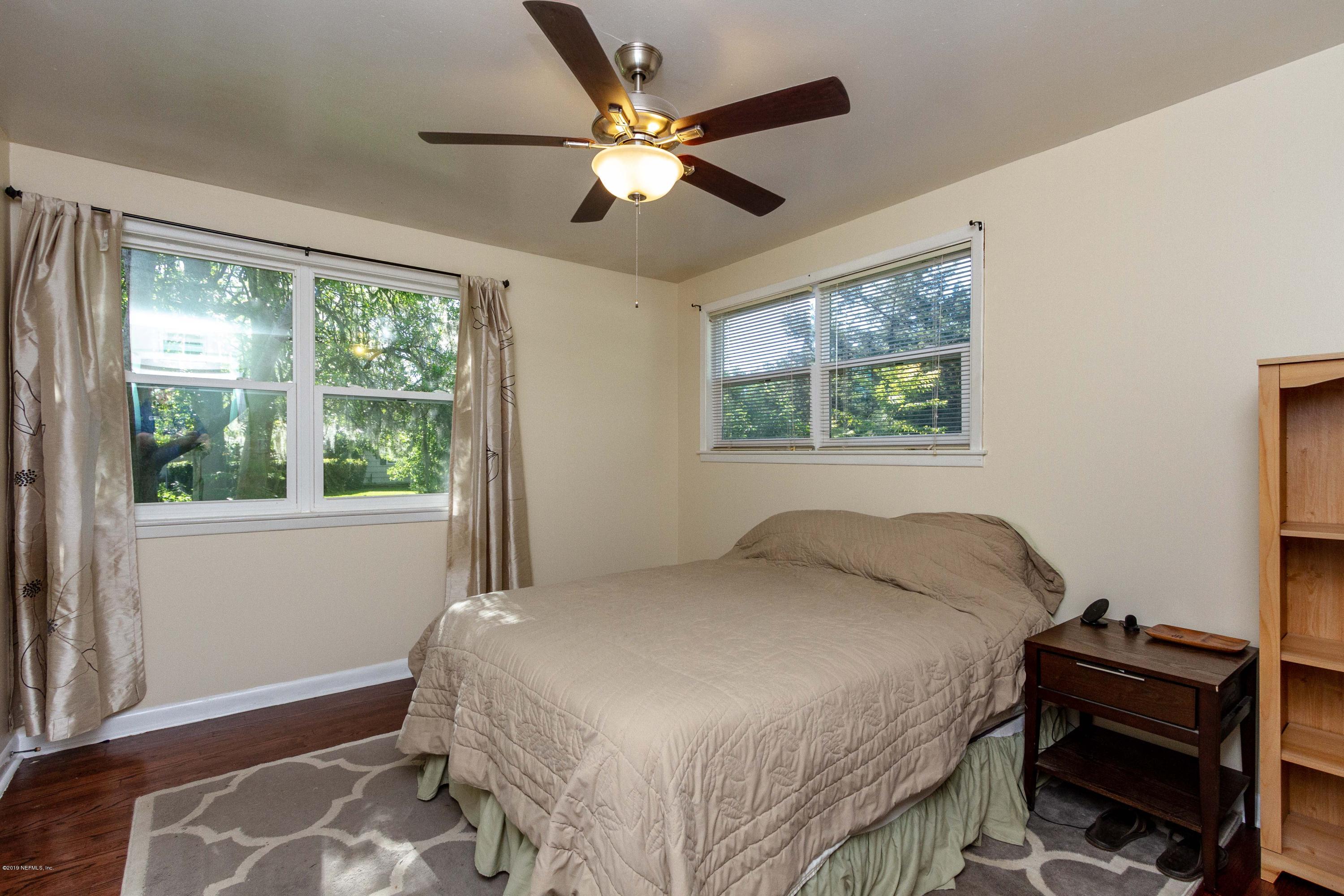 7420 Hennessy Road Jacksonville, FL 32244 - Photo 21 of 39 a bedroom with a bed and a window