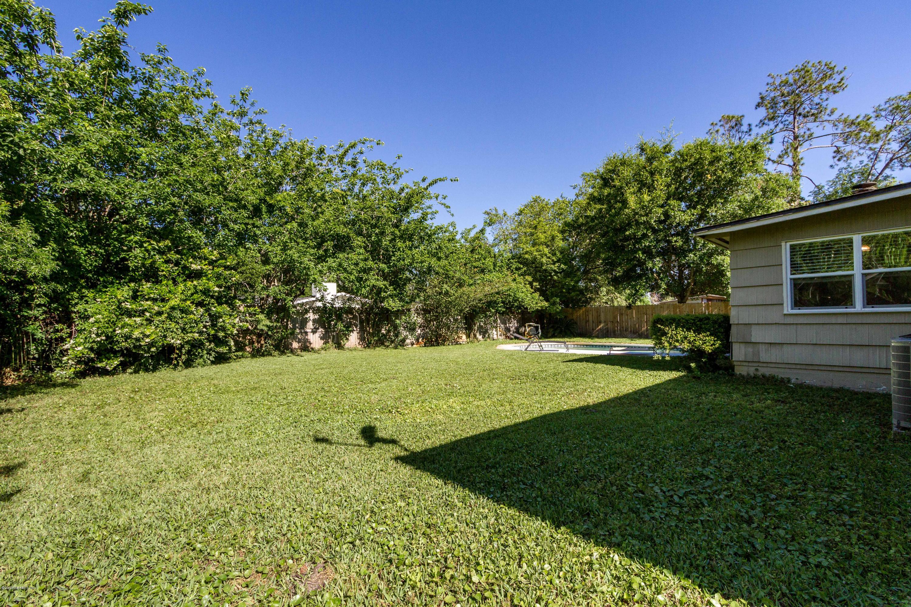 7420 Hennessy Road Jacksonville, FL 32244 - Photo 37 of 39 a view of a backyard with large trees