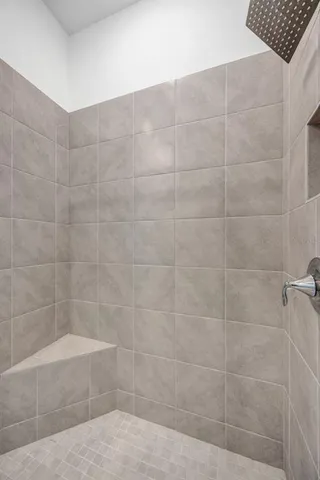 a bathroom with a granite countertop sink a toilet and a large mirror