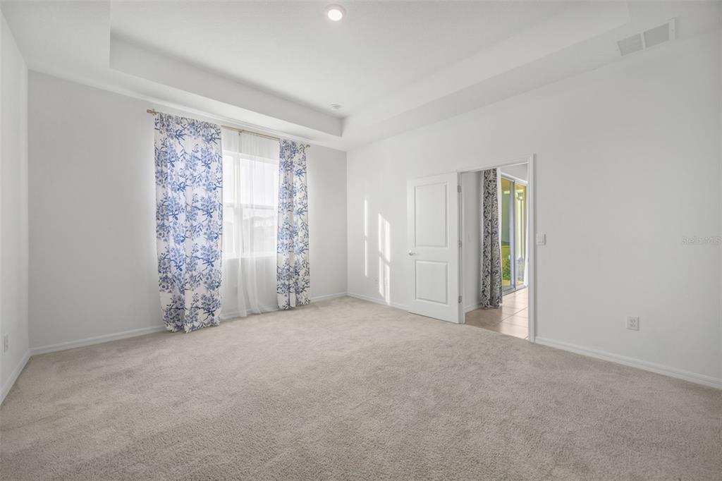 2555 Bending Bonsai Drive Wesley Chapel, FL 33543 - Photo 15 of 59 a view of an empty room with a window