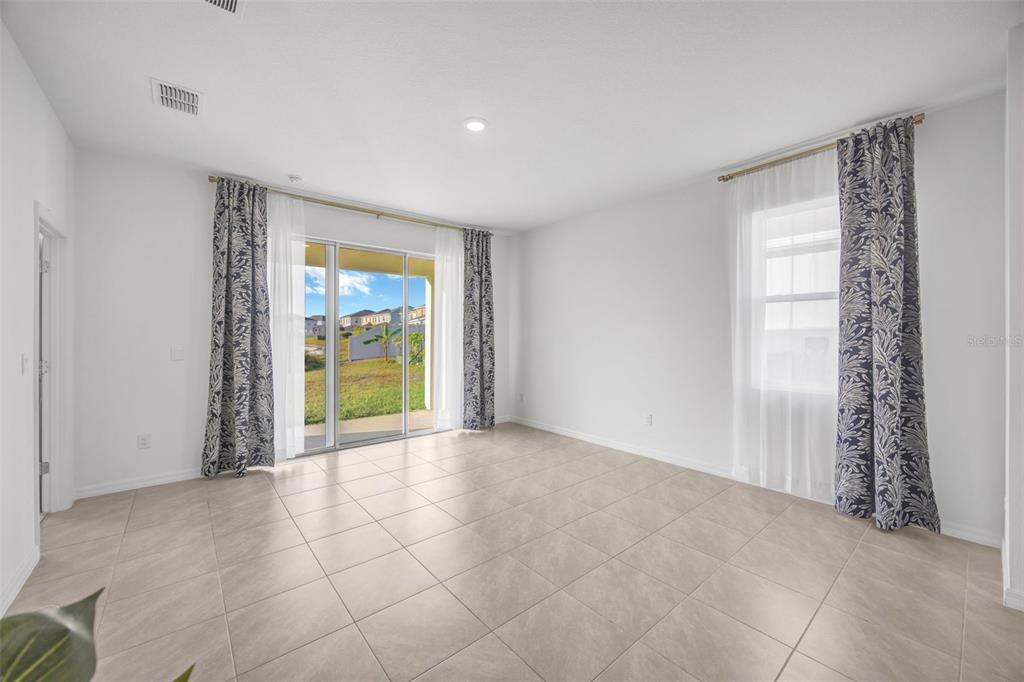 2555 Bending Bonsai Drive Wesley Chapel, FL 33543 - Photo 23 of 59 a view of an empty room with a window