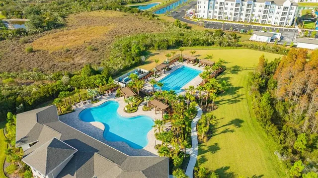 an aerial view of residential houses with swimming pool