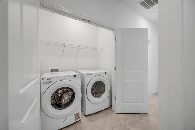 a bathroom with a granite countertop sink toilet and mirror