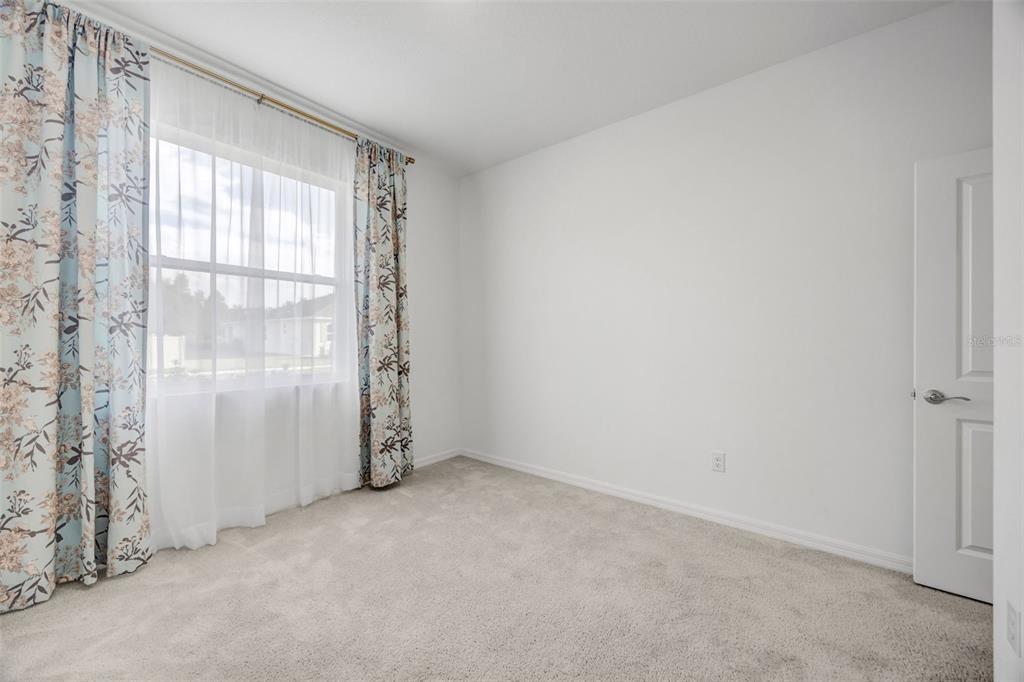 2555 Bending Bonsai Drive Wesley Chapel, FL 33543 - Photo 49 of 59 an empty room with windows