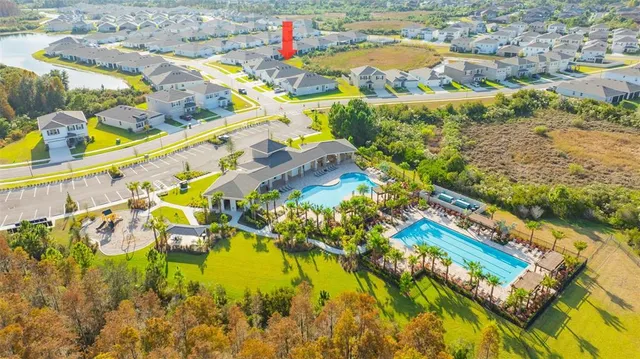 a view of swimming pool with a yard and plants