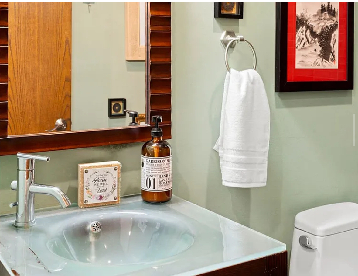 Undisclosed Address Chicago, IL 60608 - Photo 11 of 46 a bathroom with a sink and a mirror