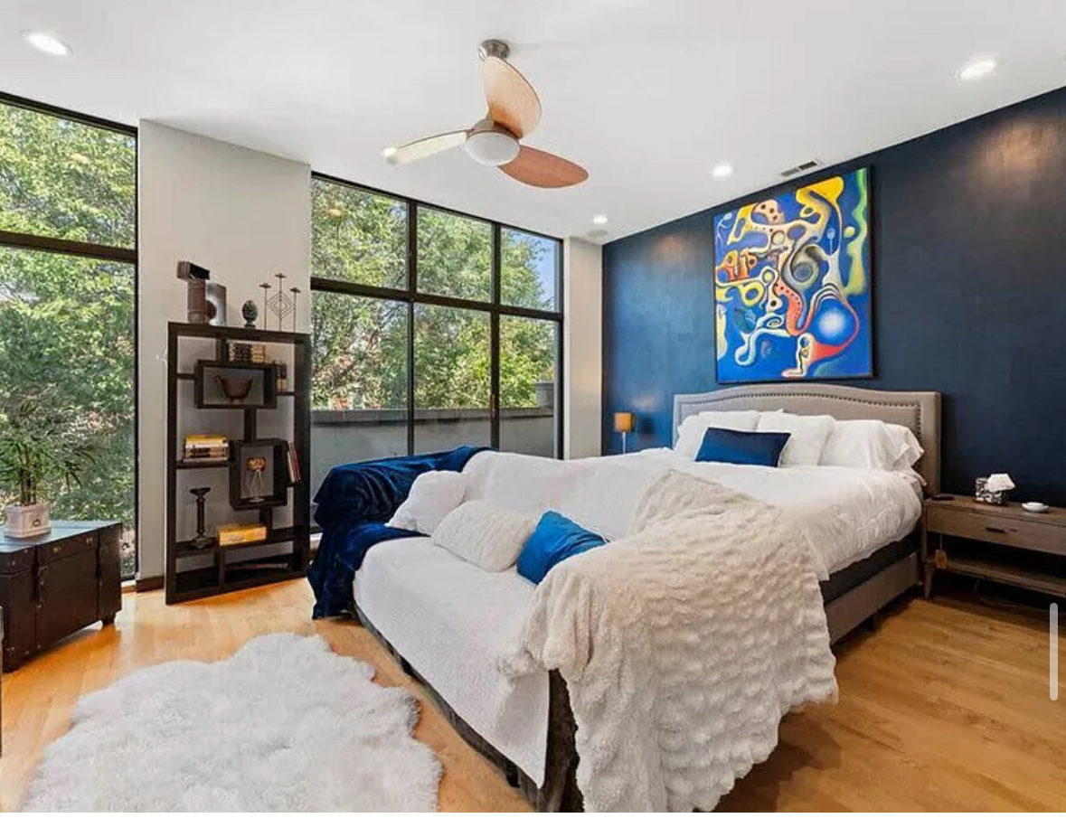 Undisclosed Address Chicago, IL 60608 - Photo 14 of 46 a bed sitting in a bedroom next to a window