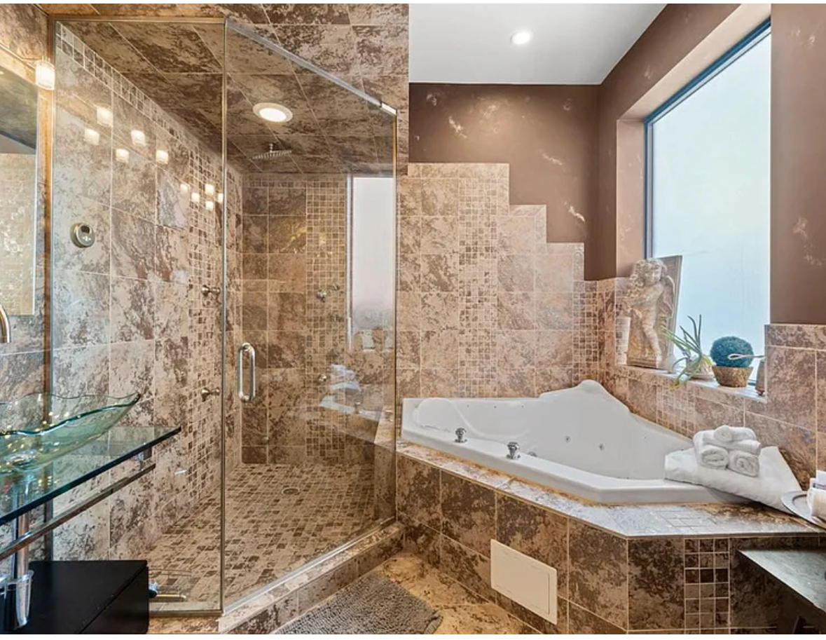 Undisclosed Address Chicago, IL 60608 - Photo 16 of 46 a bathroom with a bathtub and shower