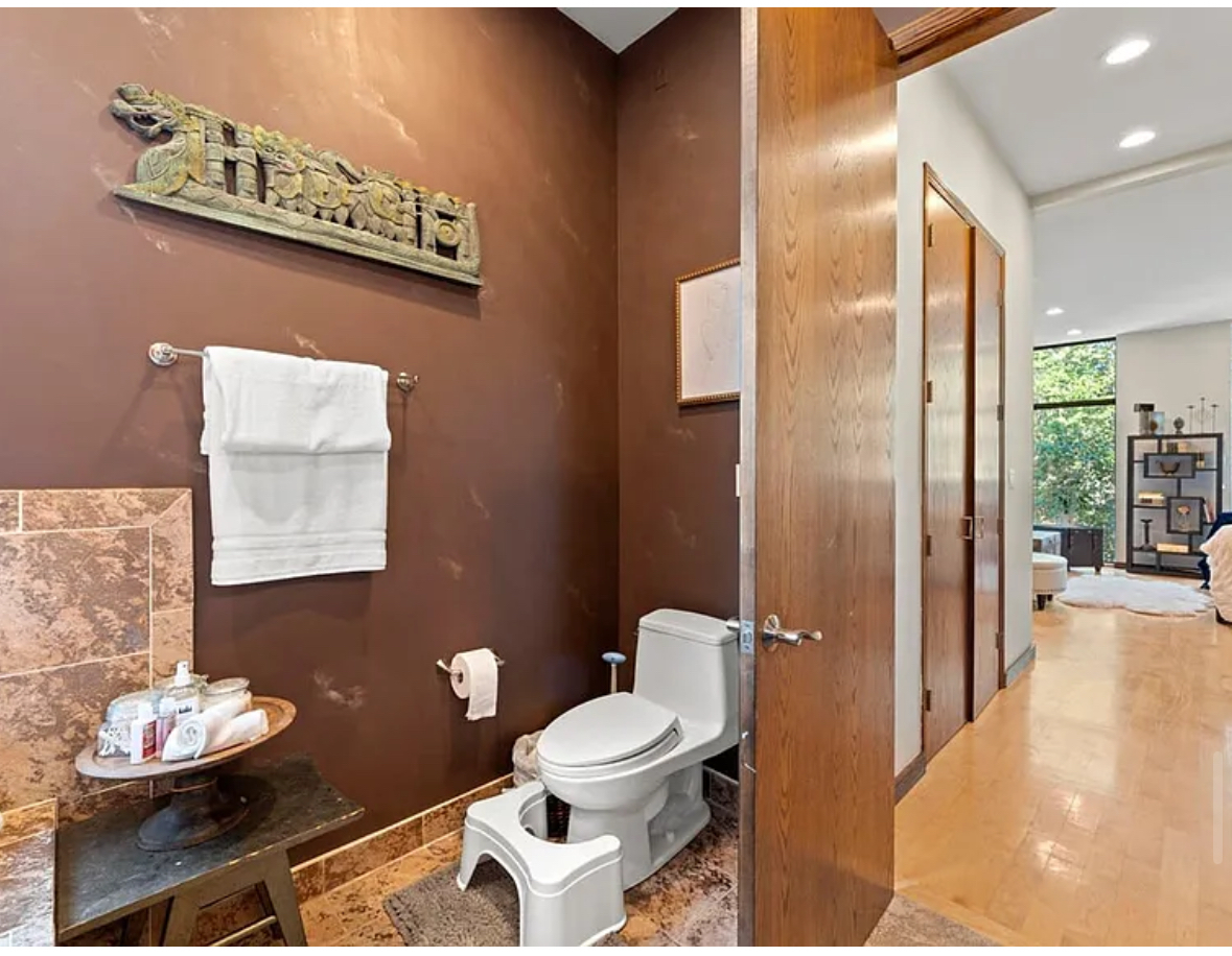 Undisclosed Address Chicago, IL 60608 - Photo 20 of 46 a bathroom with a toilet sink and mirror