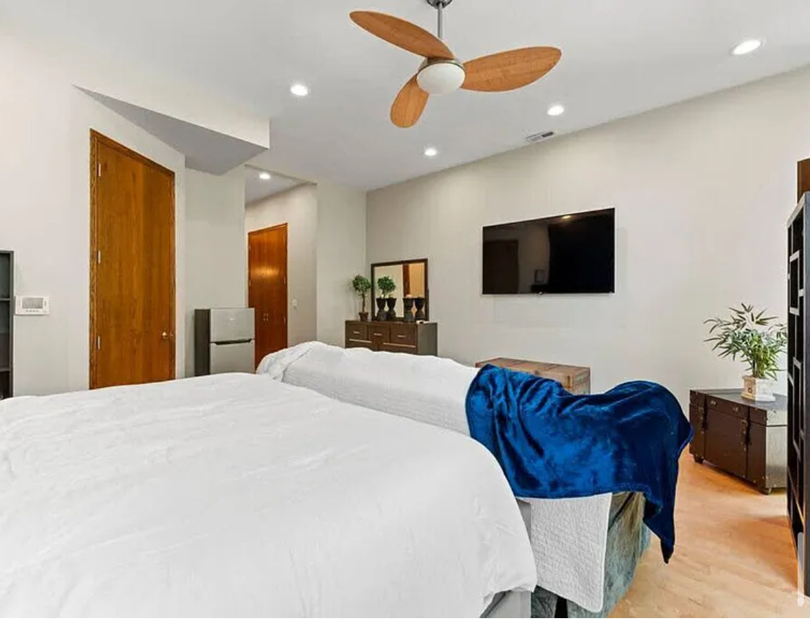 Undisclosed Address Chicago, IL 60608 - Photo 21 of 46 a bedroom with a bed and a television